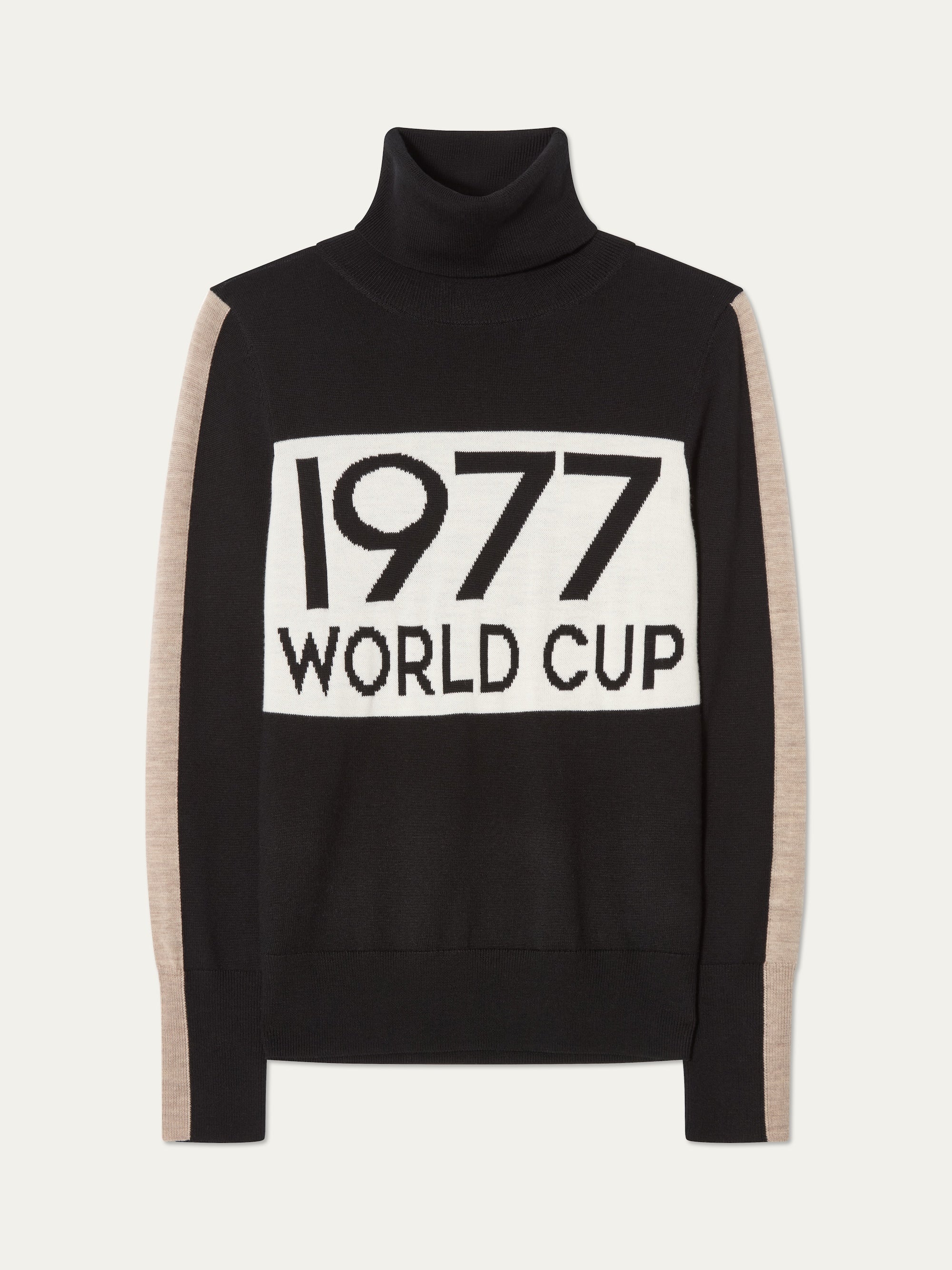 The We Norwegians 1977 World Cup Sweater Women channels ’70s ski style with a black turtleneck, beige sleeves, and a bold white front panel featuring "1977 WORLD CUP" in striking black letters.