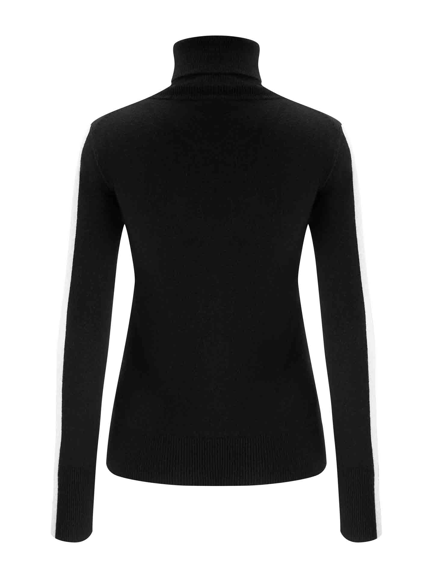 The 1977 World Cup Sweater Women by We Norwegians is showcased from the back, presenting white side stripes on its black, long-sleeved, high-neck design. Made from luxurious merino wool knitwear, the sweater fits sleekly and form-fittingly.