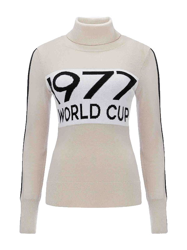 The 1977 World Cup Sweater Women by We Norwegians is a beige merino wool turtleneck with black accents on the sleeves and the bold black text "1977 WORLD CUP" prominently printed across the chest, making it ideal for embracing retro ski fashion.