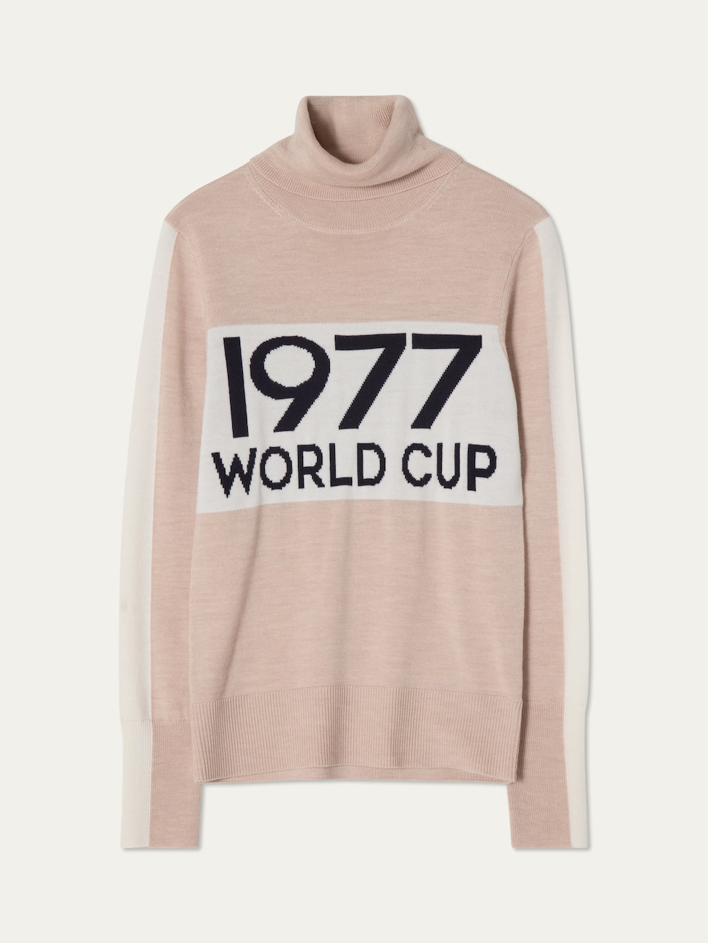 The We Norwegians World Cup Sweater women - Pre Spring 26 features light pink with white sleeve and chest panels plus bold black "1977 WORLD CUP" text, ideal for an après-ski look.