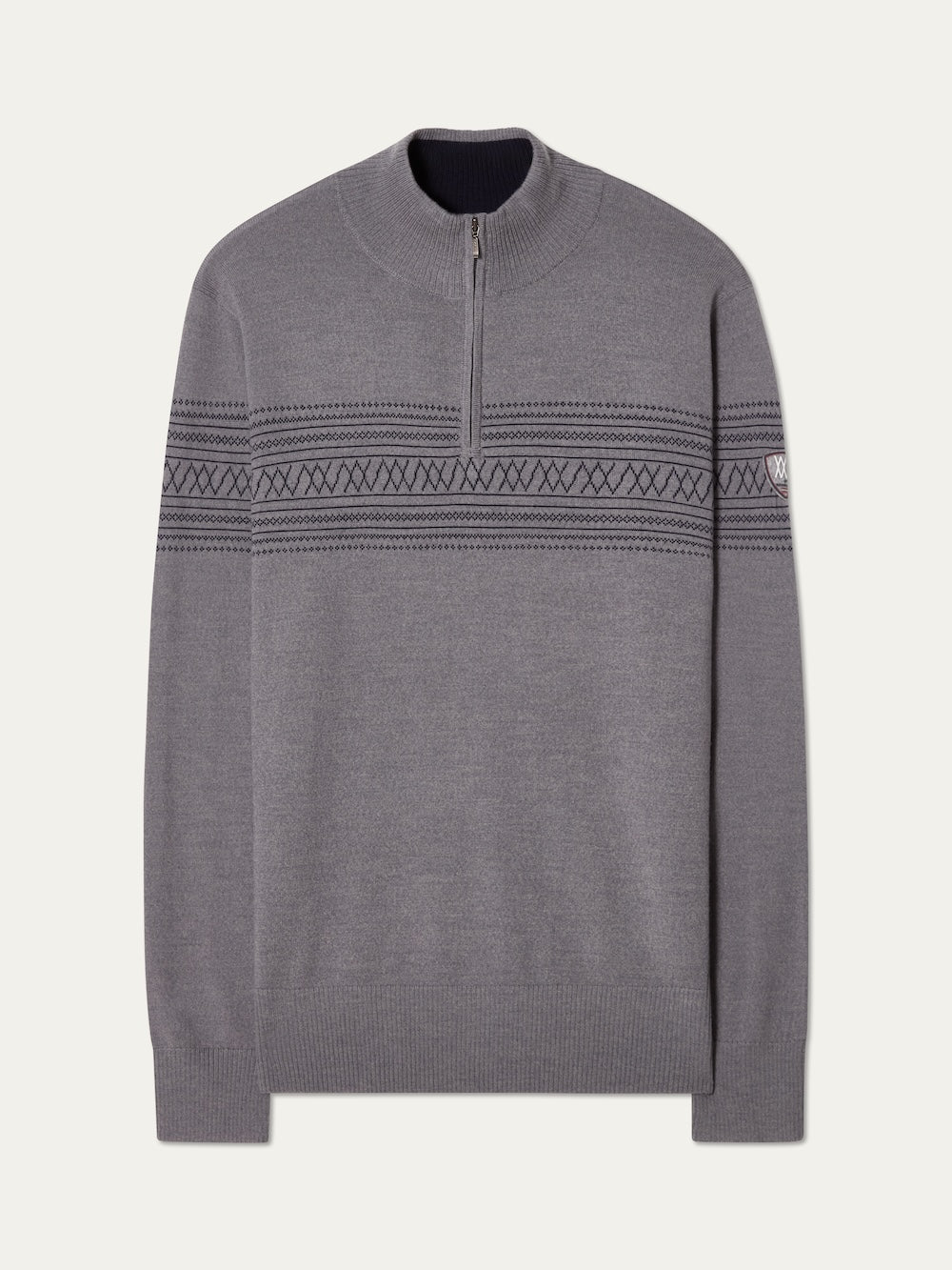 The We Norwegians Signature Zip Up Men is a grey Merino wool sweater with a quarter-zip collar, dark Norwegian Setesdal patterns on the chest and arms, ribbed cuffs and hem, and a subtle logo patch on the left sleeve.