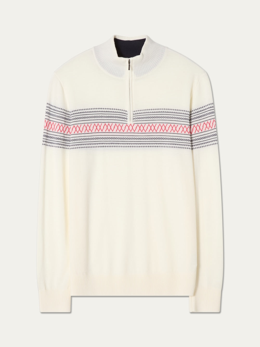 The Signature Zip Up Men by We Norwegians is a cream-colored, long-sleeve sweater made from washable merino wool, featuring a half-zip collar and black and red patterned stripes across the chest and sleeves.