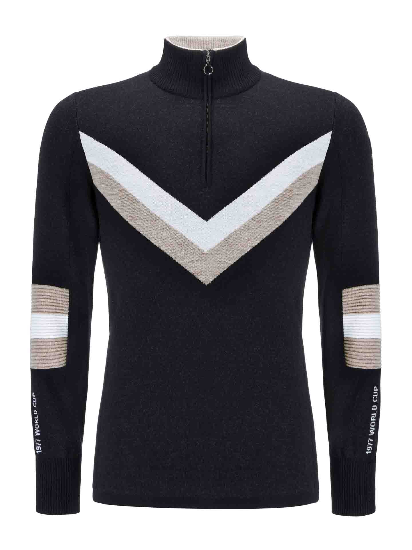 The Hafjell Zip Up Men by We Norwegians is a black, long-sleeved sweater with a zip-up high collar, made by Italian knitters from 100% fine merino wool. It features a large white and beige V-shaped stripe on the chest and matching horizontal stripes on the elbows, with "1977 WORLD CUP" printed on the lower section of each sleeve.