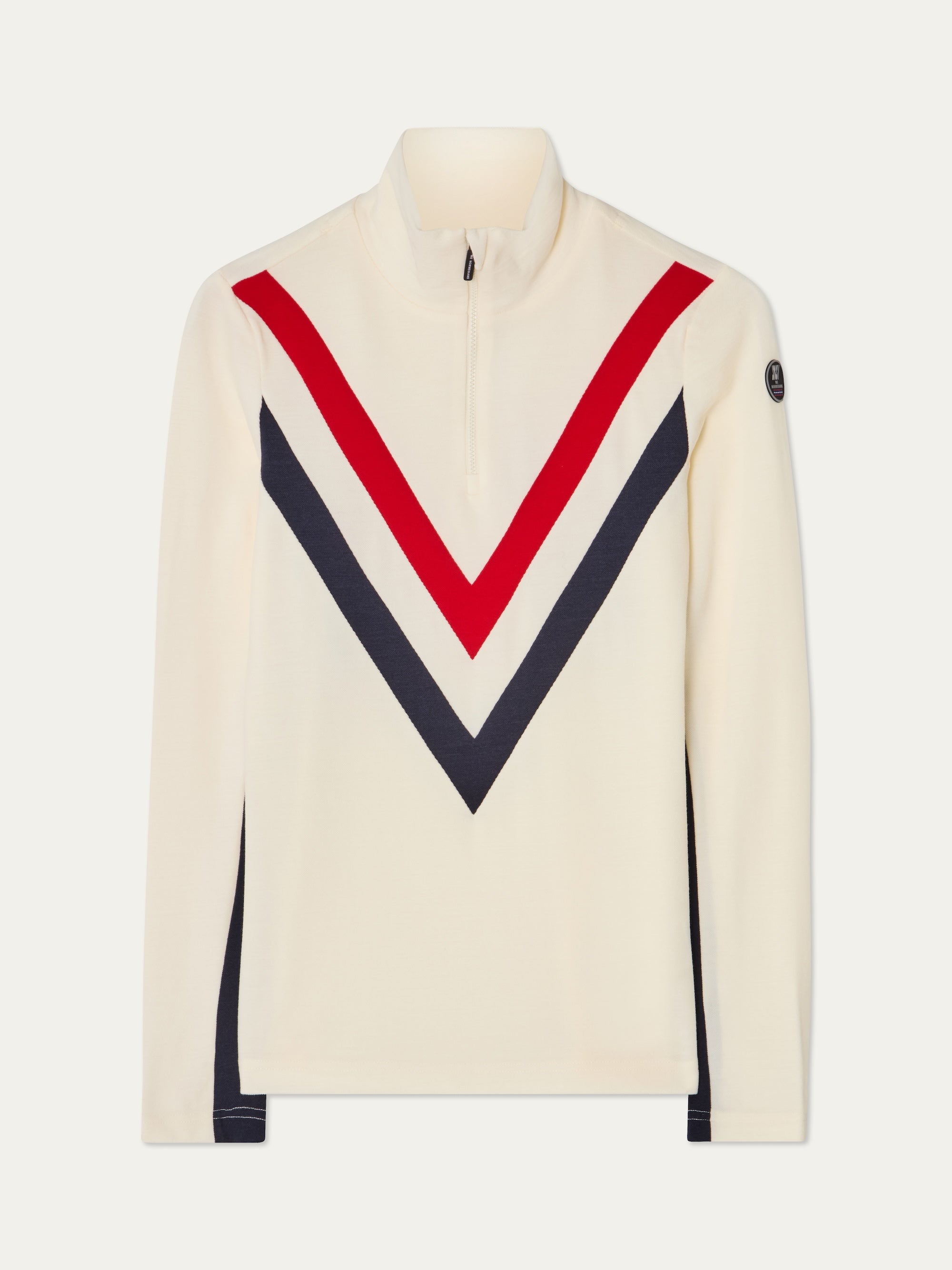 The We Norwegians Voss Chevron ZipUp Women is a cream long-sleeve piqué pullover with a quarter zip, red and navy chevron V stripes on the front, and a small dark patch on the upper left sleeve.