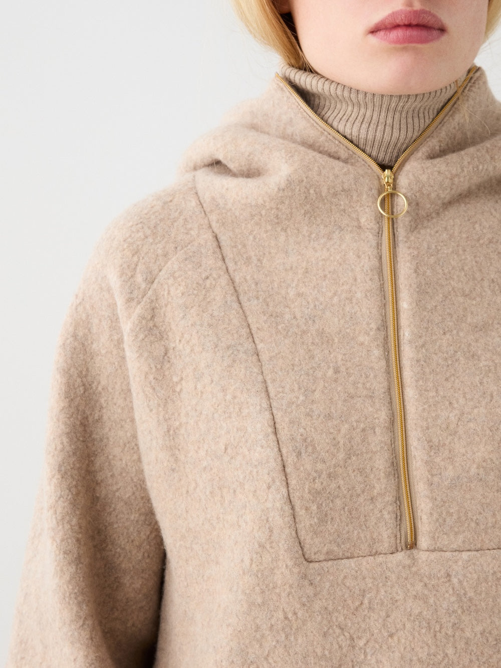 We Norwegians | FW25 | Womens Alta Hoodie_Camel | Person wearing the  hooded sweater | Close-up