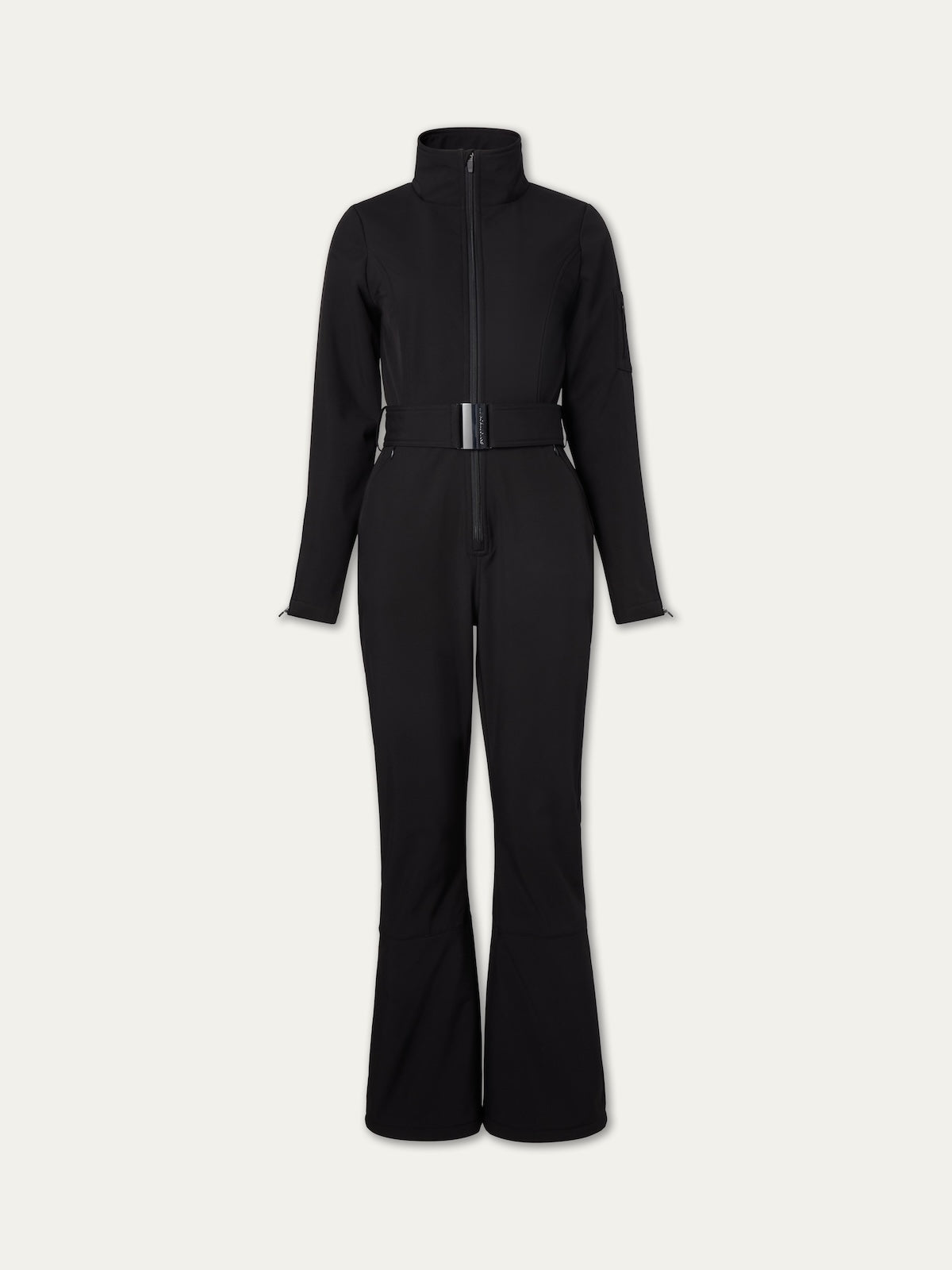 The Tyin Ski Suit Women by We Norwegians is a black, long-sleeve ski suit made from water-repellent soft shell, featuring a high collar, front zipper, flared legs, and a matching waist belt, shown on a plain light background.
