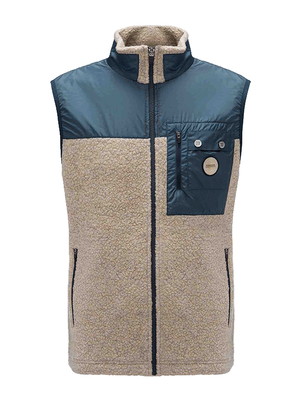 The We Norwegians Alta Vest Men is a beige fleece après-ski vest featuring a high collar, blue nylon yoke, and chest pocket. It includes a zip front, zippered hand pockets, and a buttoned flap pocket on the left chest area.