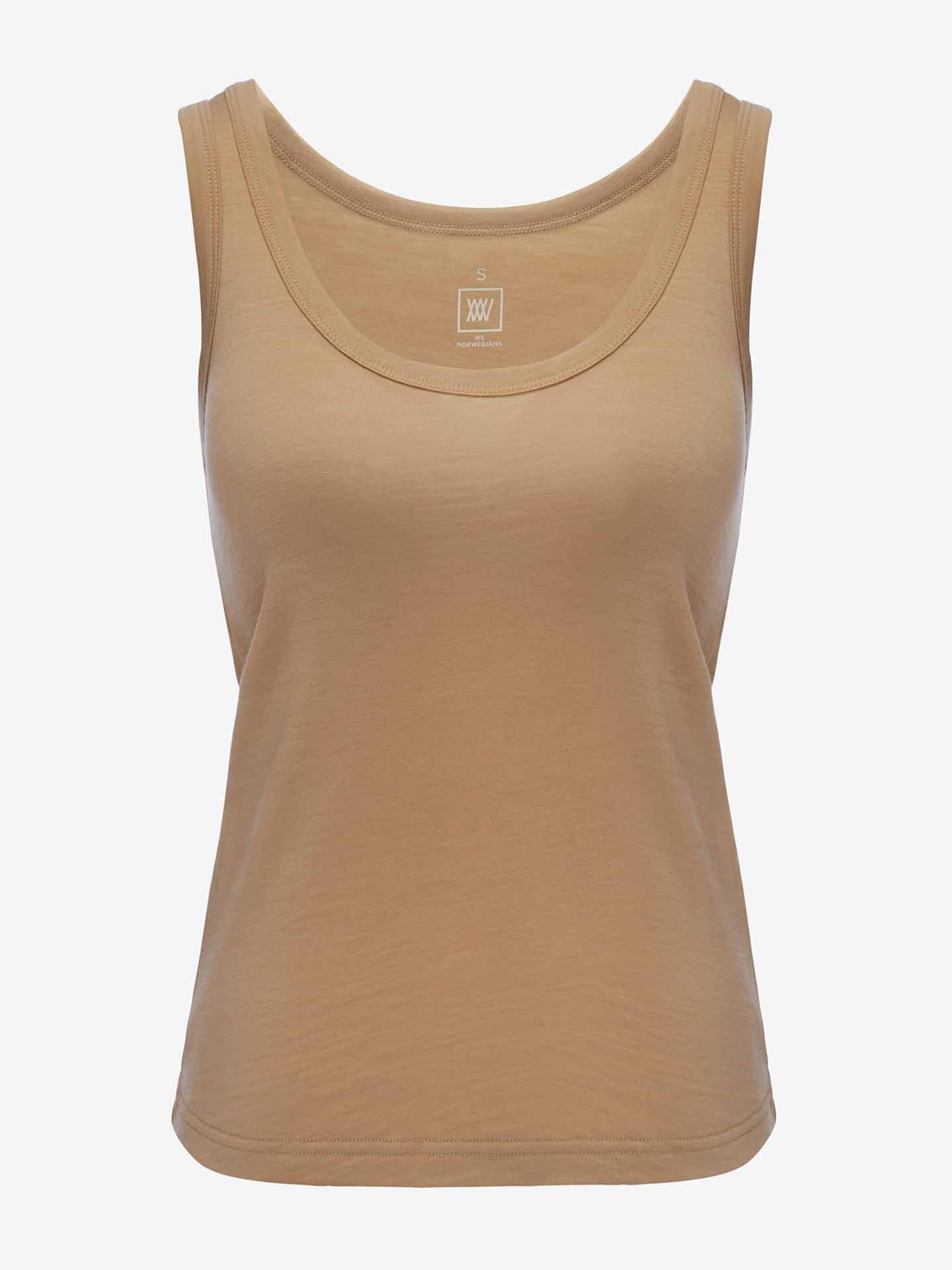 A beige Sno Merino Tank Top Women by We Norwegians, featuring a round neckline and crafted from super fine merino wool, is displayed on a plain white background. The fabric appears soft and slightly fitted, epitomizing Scandinavian luxury base-layer. A tag indicating size "S" is visible inside the neckline area.