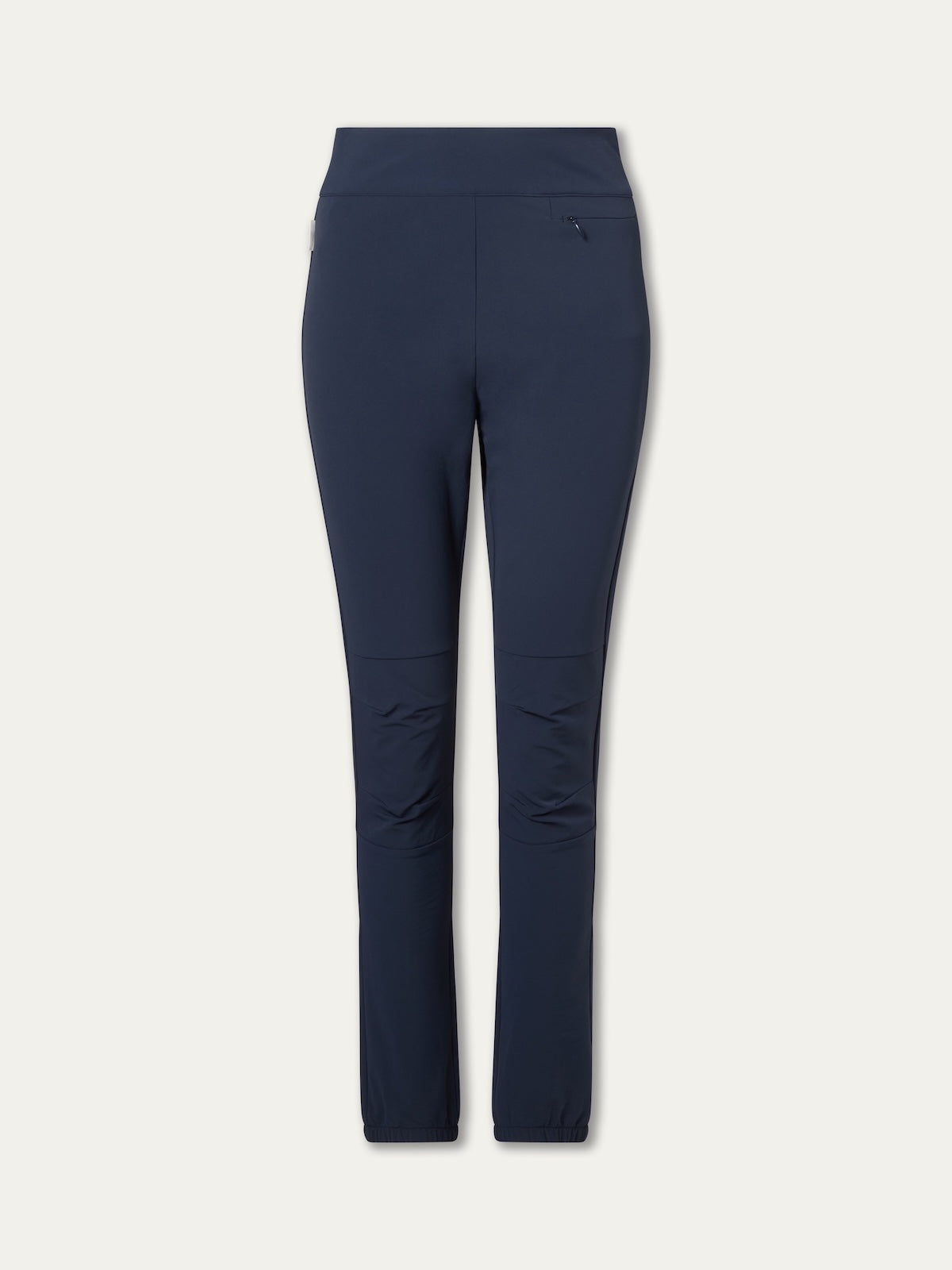 The We Norwegians Beito Pant Women in navy blue features a slim fit, high waistband, right hip zip pocket, and subtle knee seams—ideal for outdoor training—shown against a plain light background.
