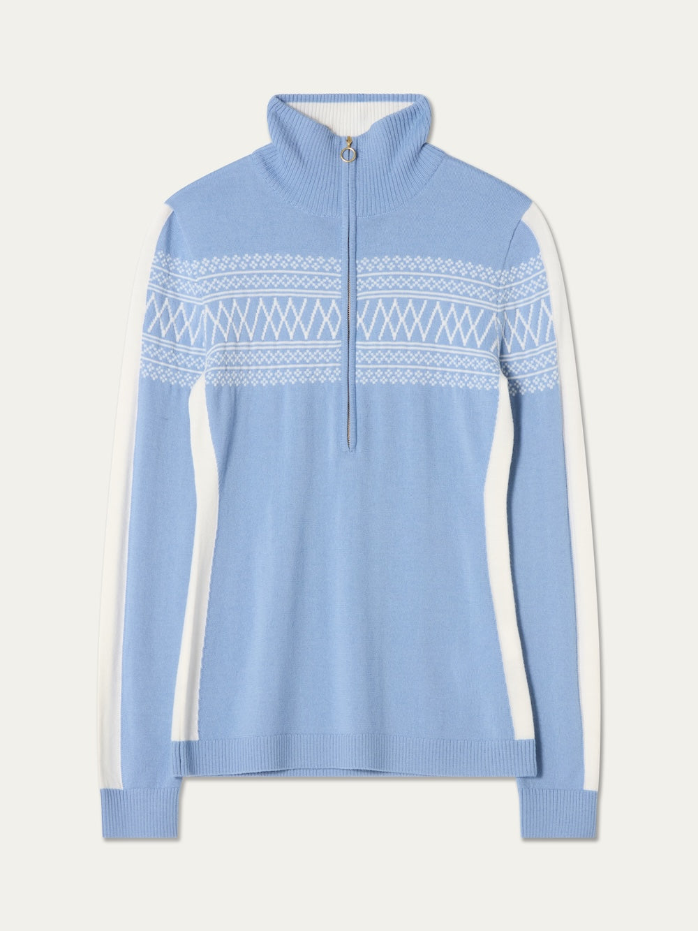 The We Norwegians Signature 1/4-Zip Women is a light blue pullover sweater with a classic Setesdal pattern of white geometric designs across the chest, complemented by white side panels, a signature 1/4-zip collar, and long sleeves.