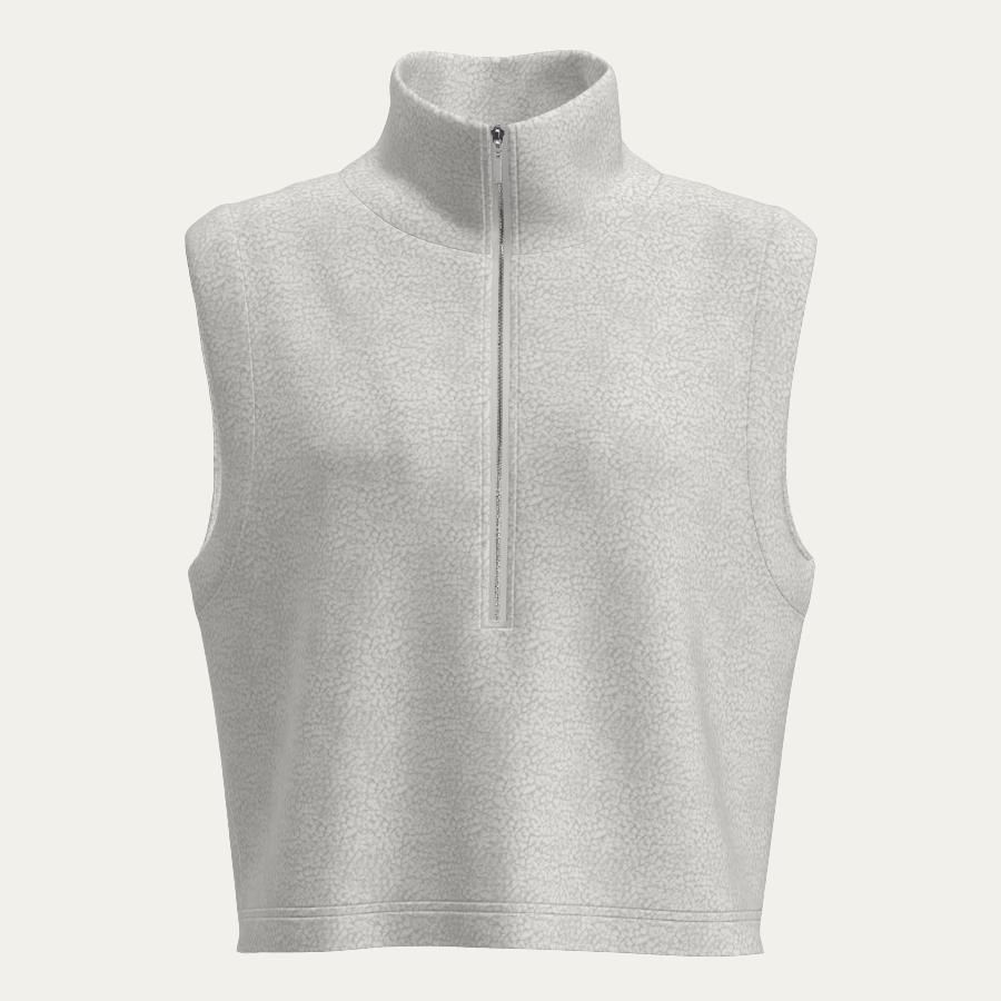 The We Norwegians Alta Vest Women is a sleeveless, light gray fleece layer with a high collar and half-zip front, shown against a plain light background.