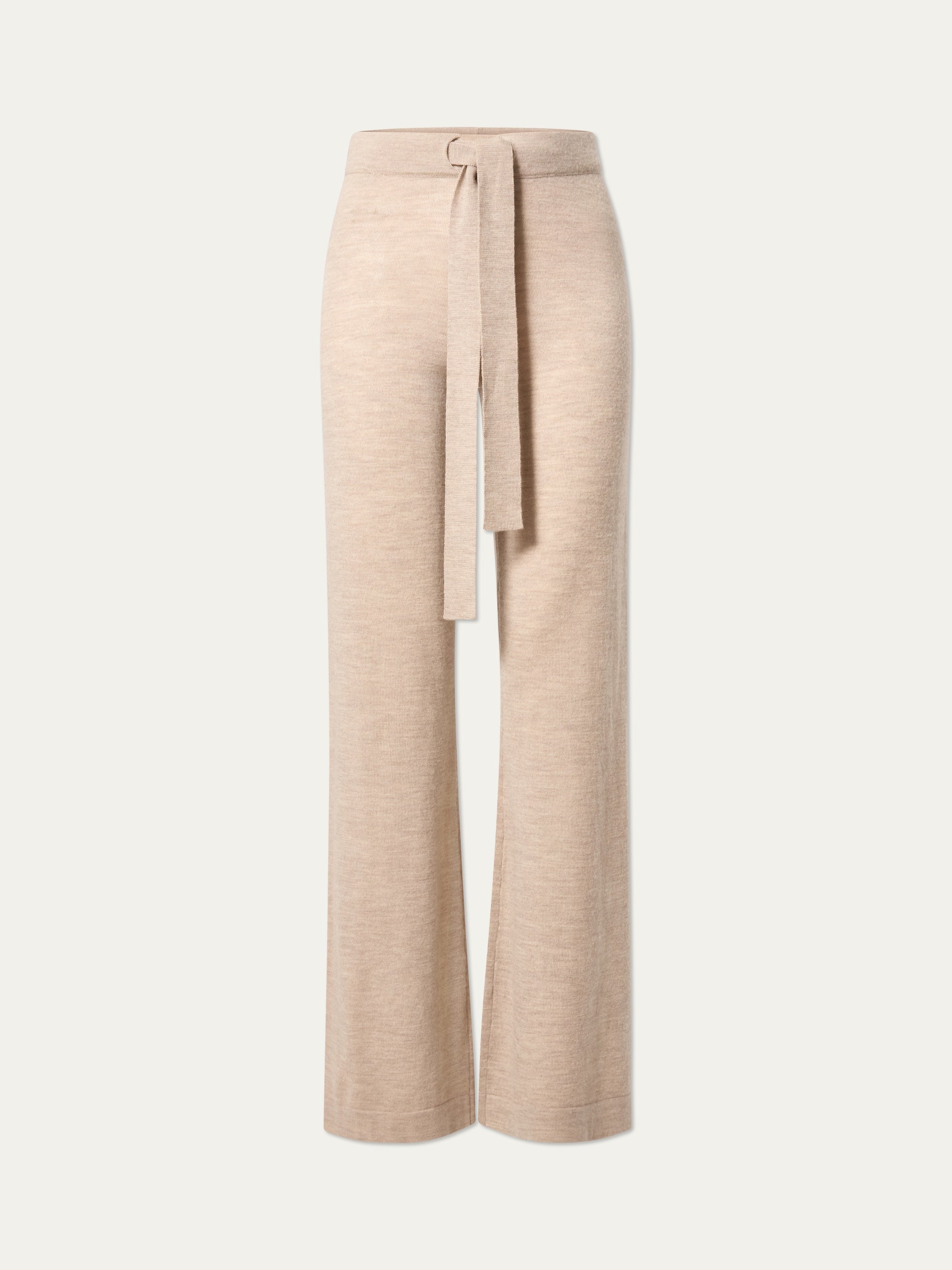 The We Norwegians Geilo Belted Pant Women features beige flared merino wool and a matching fabric waist tie—ideal lounge pants for effortless style and comfort, shown against a plain light background.