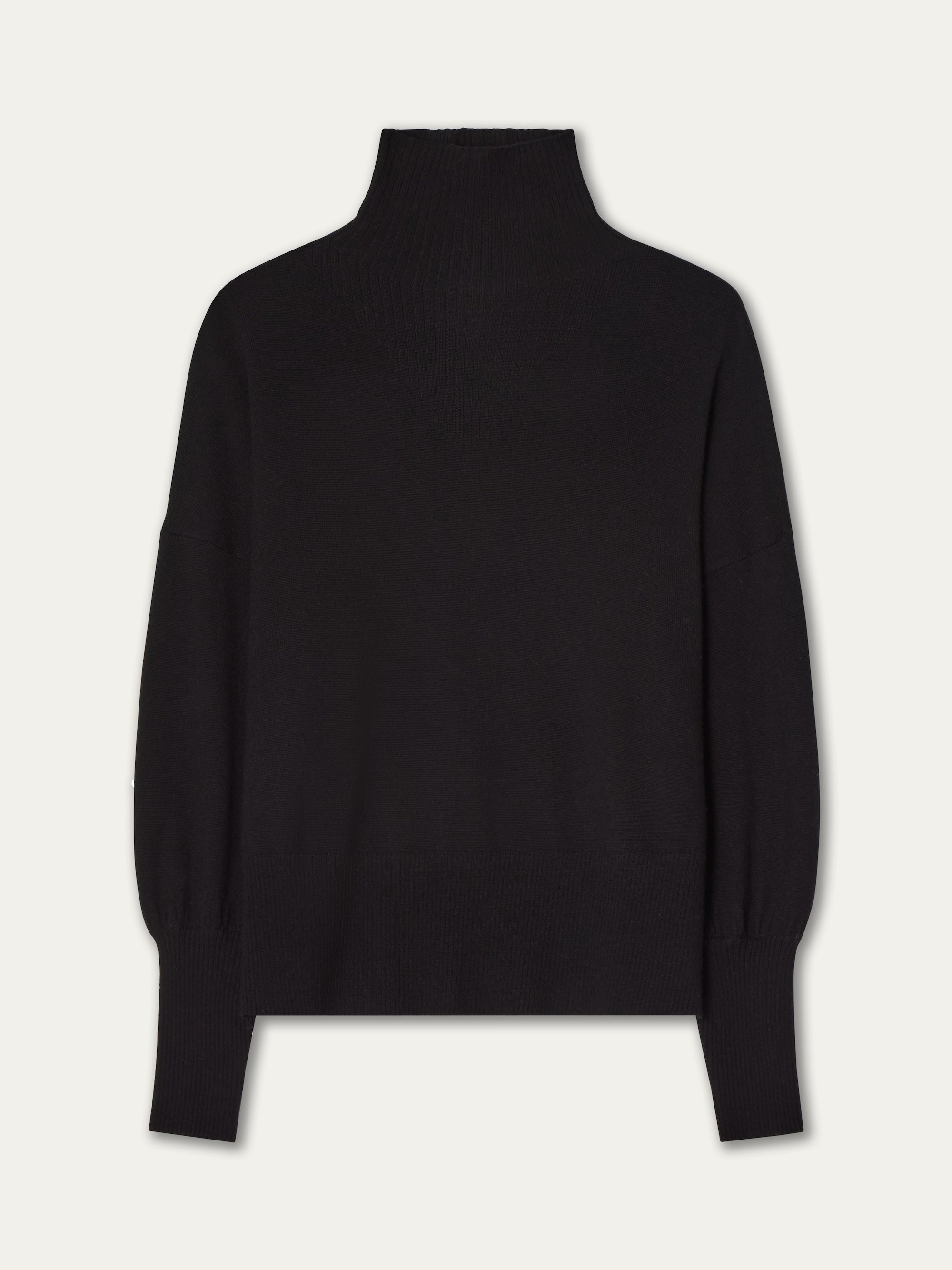 The We Norwegians Geilo Oversized Sweater Women is a lightweight, black merino wool knitwear piece with long sleeves and a relaxed fit, shown against a light background.