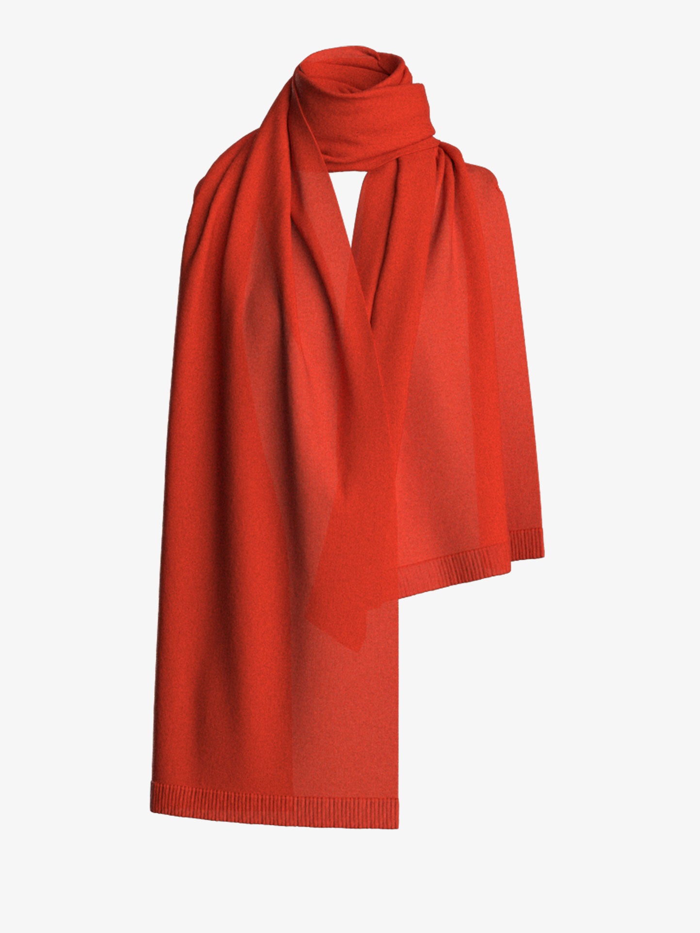 The We Norwegians Blefjell Cashmere Scarf is elegantly draped in a loop, showcasing its luxurious, vibrantly red fabric and classic design on a plain white background.