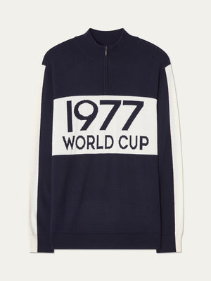 The We Norwegians 1977 World Cup Zipup Men’s sweater features a navy body, white sleeves, bold “1977 WORLD CUP” text on the front, alpine ski sweater accents, and a classic quarter-zip collar.