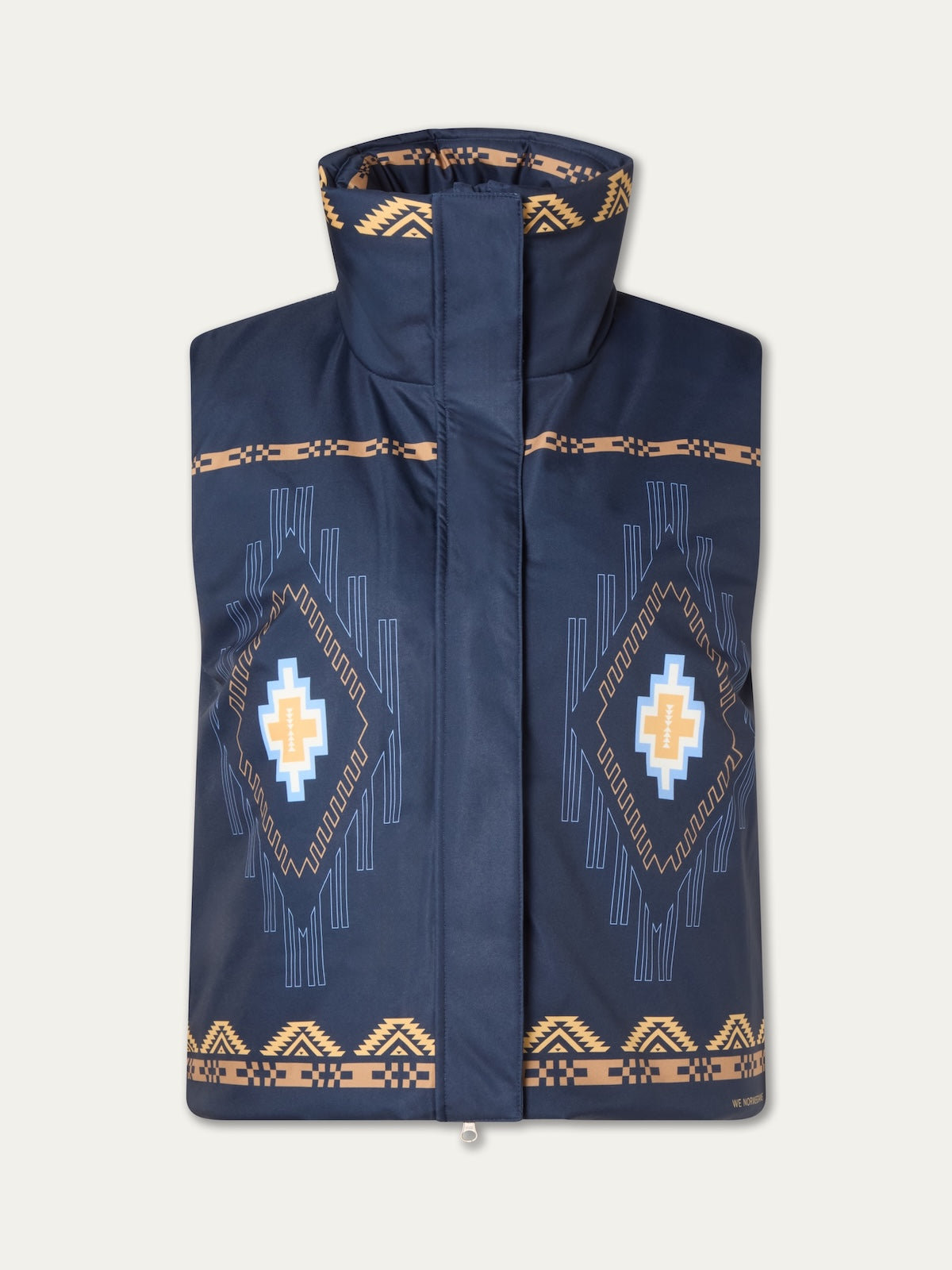 The We Norwegians Pioneer Vest for women is a navy blue wool insulated vest with beige and light blue geometric patterns, inspired by Indigenous American art, featuring a high collar and front closure.