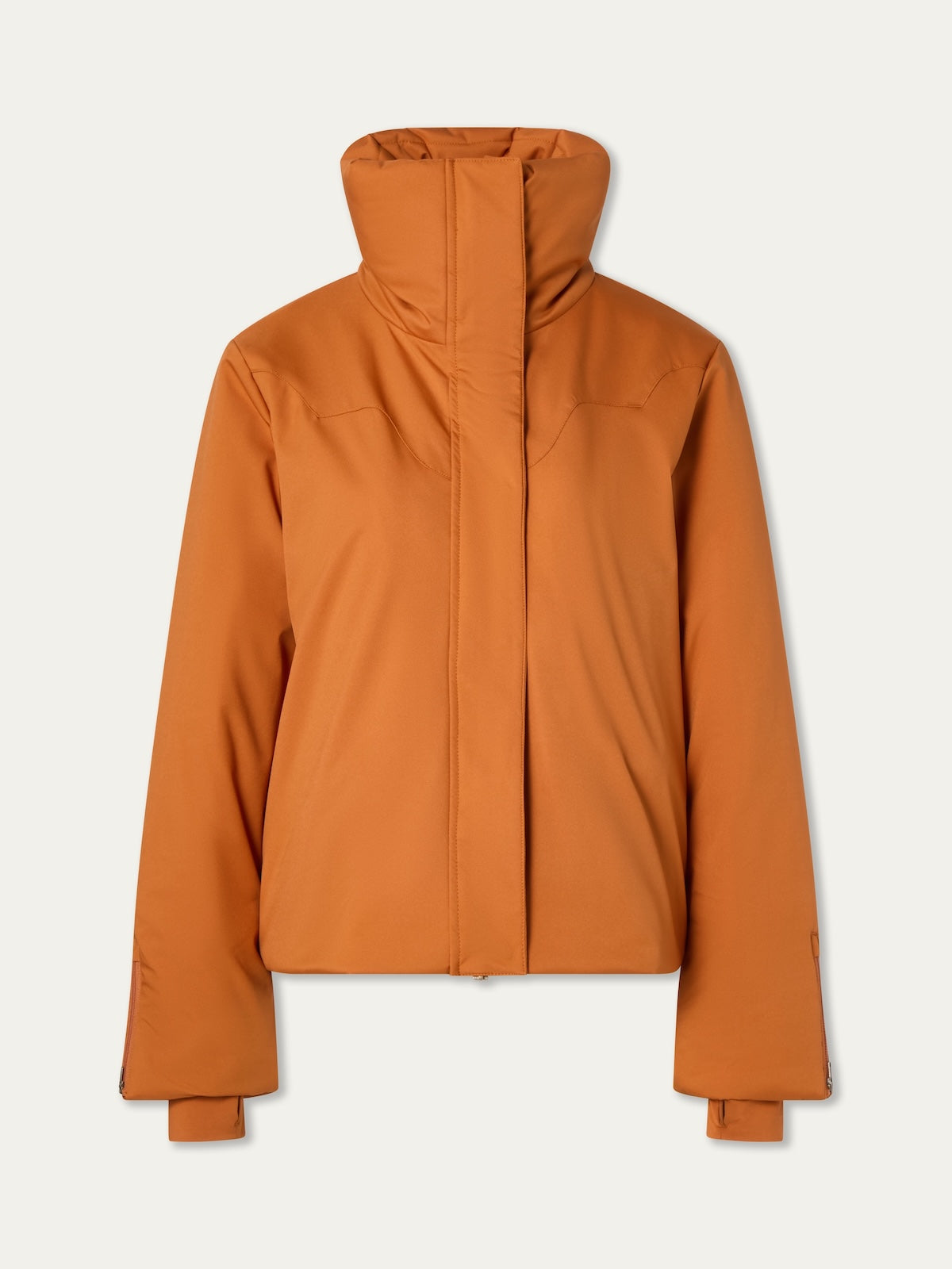 The We Norwegians Western Ski Jacket women is a rust-orange, long-sleeve jacket with a high padded collar, natural wool padding, and a concealed front zipper, shown against a plain light background.