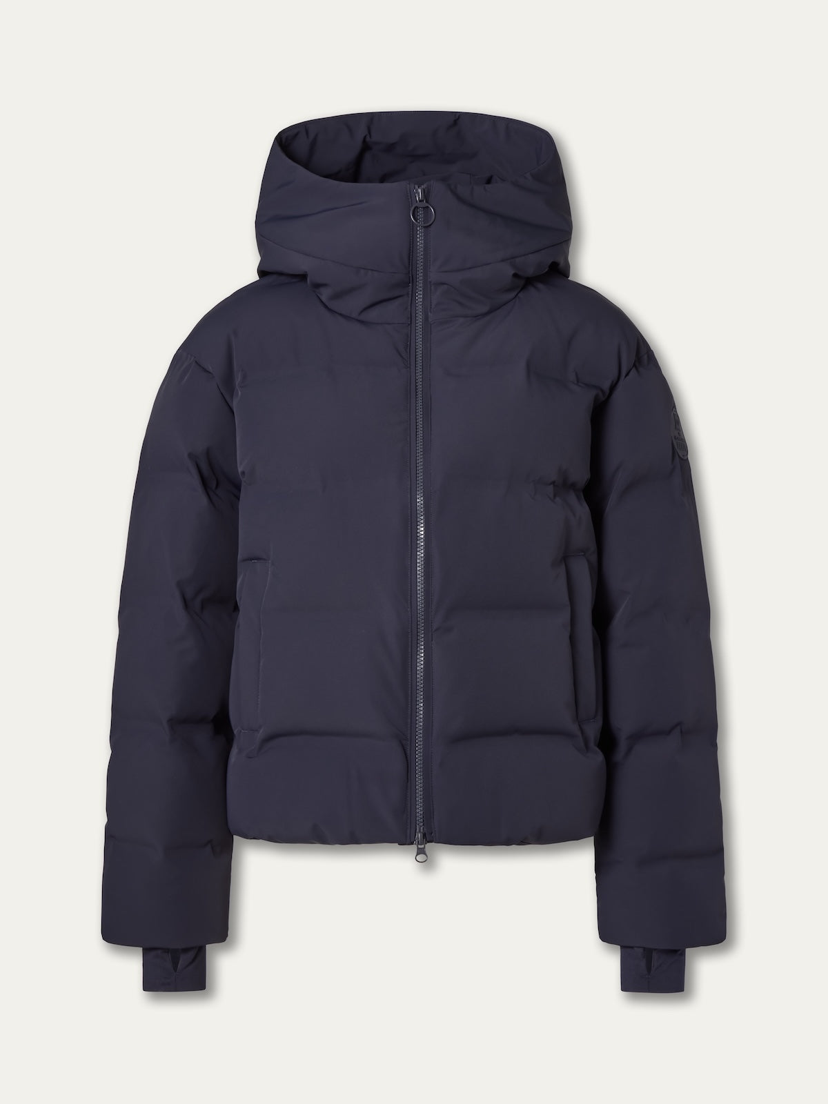 The We Norwegians Aurora Ski Jacket women is a dark navy blue puffer with responsible down, a front zipper, hood, and long sleeves, shown against a light background.
