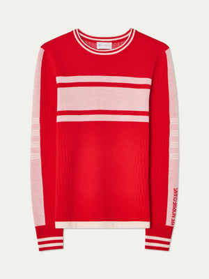 The We Norwegians Rocky Ski Sweater women is a retro long-sleeve red top with light pink chest and sleeve stripes, white trim at the collar and cuffs, and "NEW YORK FRANK" in pink on the left sleeve.