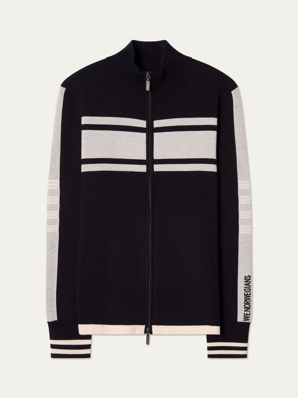 The Rocky FullZip men sweater by We Norwegians is a black zip-up with a high collar, white and light gray stripes across the chest and arms, and "NEW YORK DREAMS" text near the wrist for a retro racing knit feel.