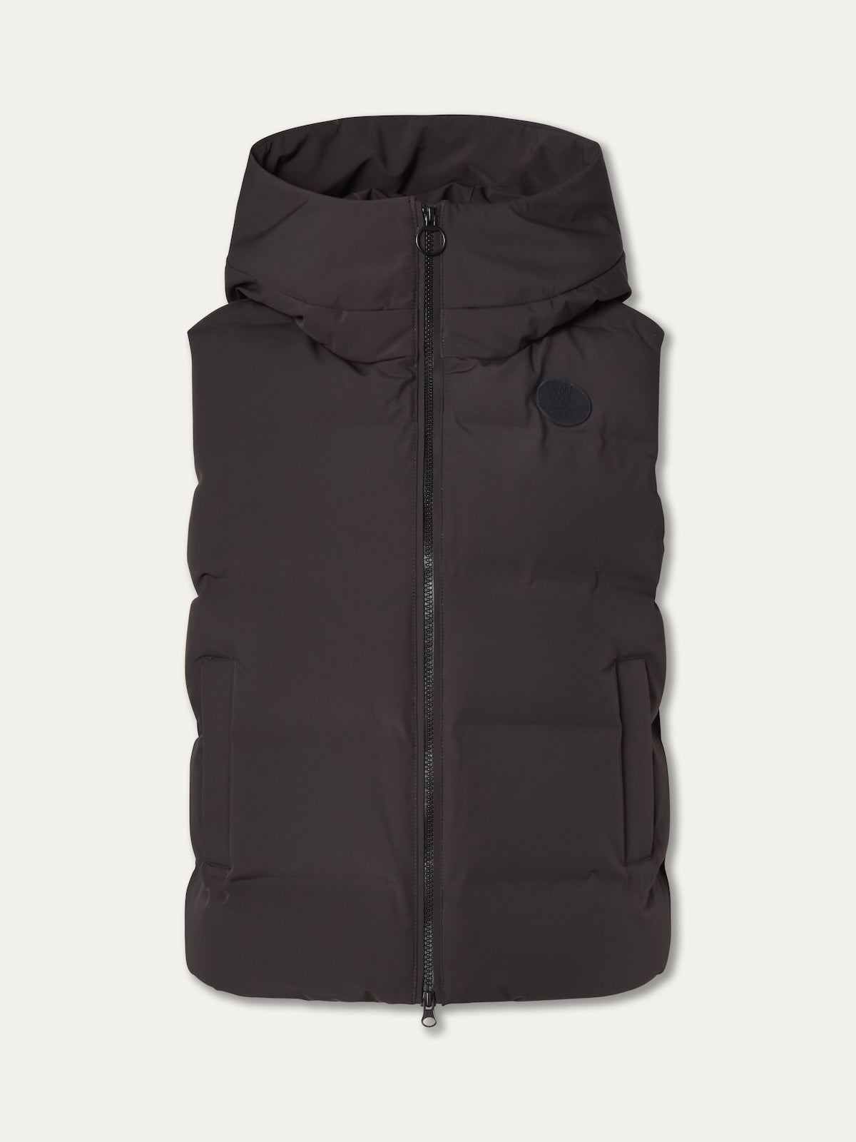 The We Norwegians Aurora Vest women is a black, sleeveless down vest with a zipper front, two side pockets, and a hood. A circular logo on the left chest reflects its clean Scandinavian style.