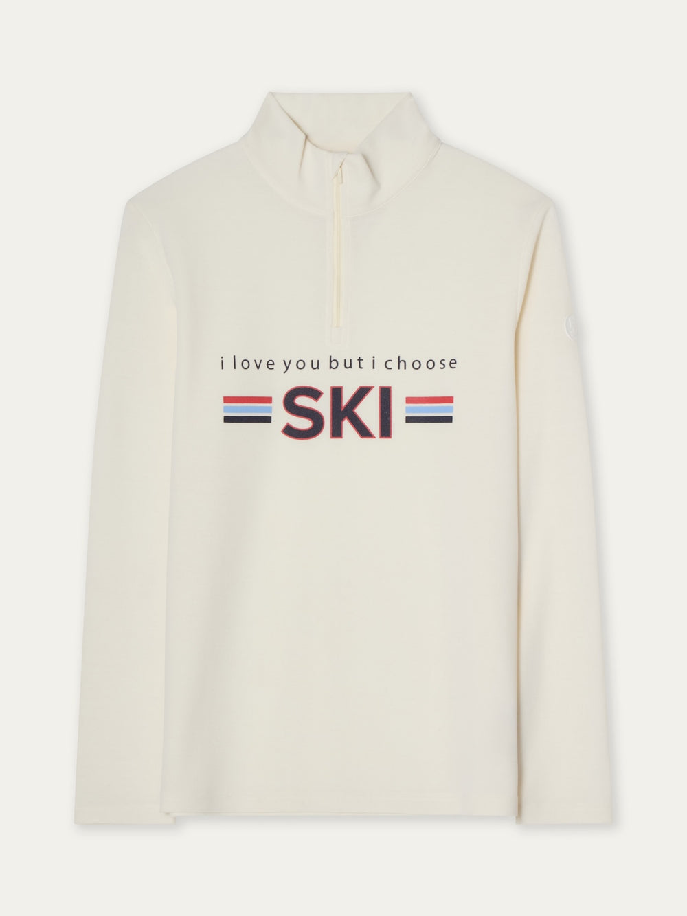 The Bibi ZipUp women by We Norwegians is a cream long-sleeve ski base layer with a high collar, short front zipper, and “i love you but i choose SKI” on the front, accented by red and blue stripes for vintage ski style.