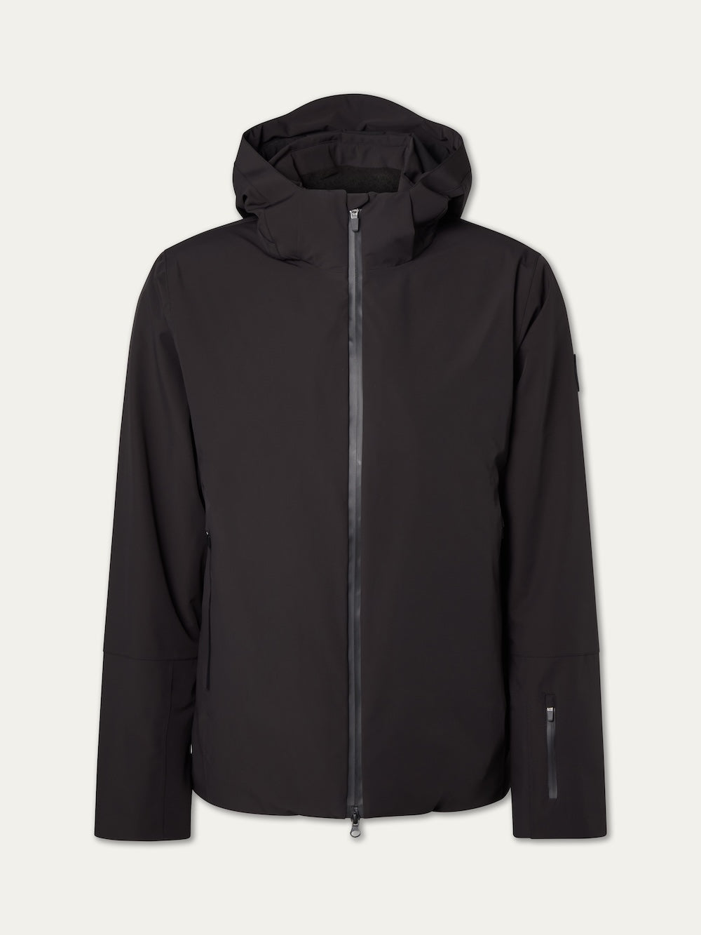 The We Norwegians Hammerfest Ski Jacket men in black features a front zipper, long sleeves, zippered sleeve pocket, and 4-way stretch for comfort and flexibility, shown against a plain light background in a sleek minimalist design.