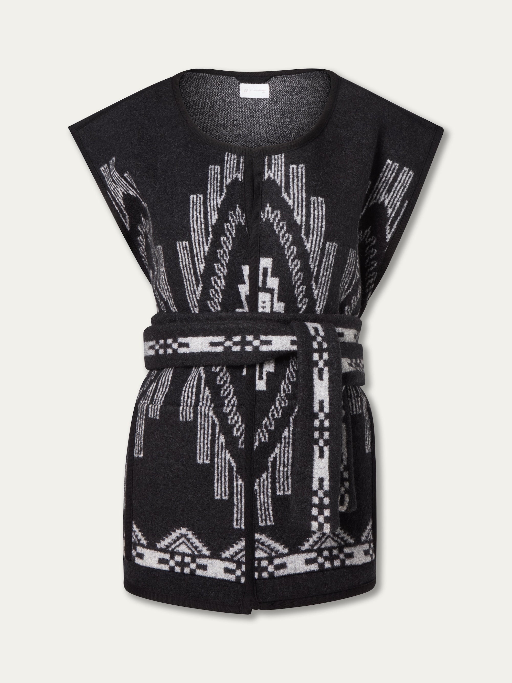 The We Norwegians Kautokeino Vest for women is a sleeveless black Merino wool piece with a white geometric jacquard pattern, round neckline, and matching waist belt.