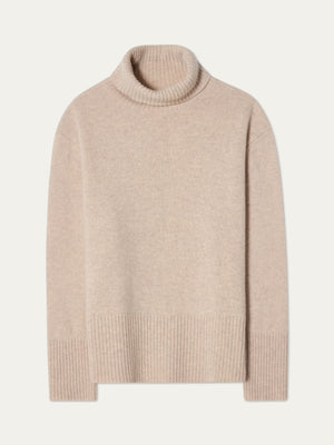 The We Norwegians Geilo BoyFriend Sweater for women in beige, made from Extrafine Merino Wool, features long sleeves with ribbed cuffs, hem, and neck, and is shown flat on a light background.