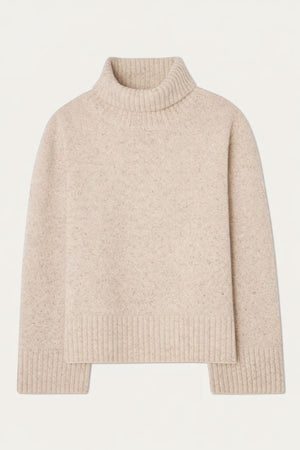 The We Norwegians Highland Sweater for women is a beige, long-sleeved Merino wool top with ribbed turtleneck collar, cuffs, and hem. RWS certified. Displayed flat on a white background.