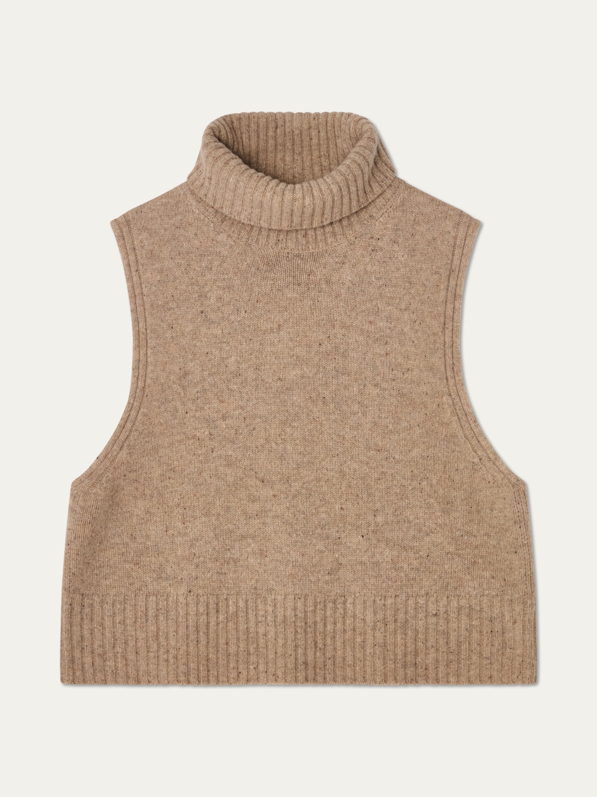 The We Norwegians Highland Vest for women is a sleeveless light brown merino wool piece with ribbed collar, armholes, and hem, shown laid flat on an off-white background.