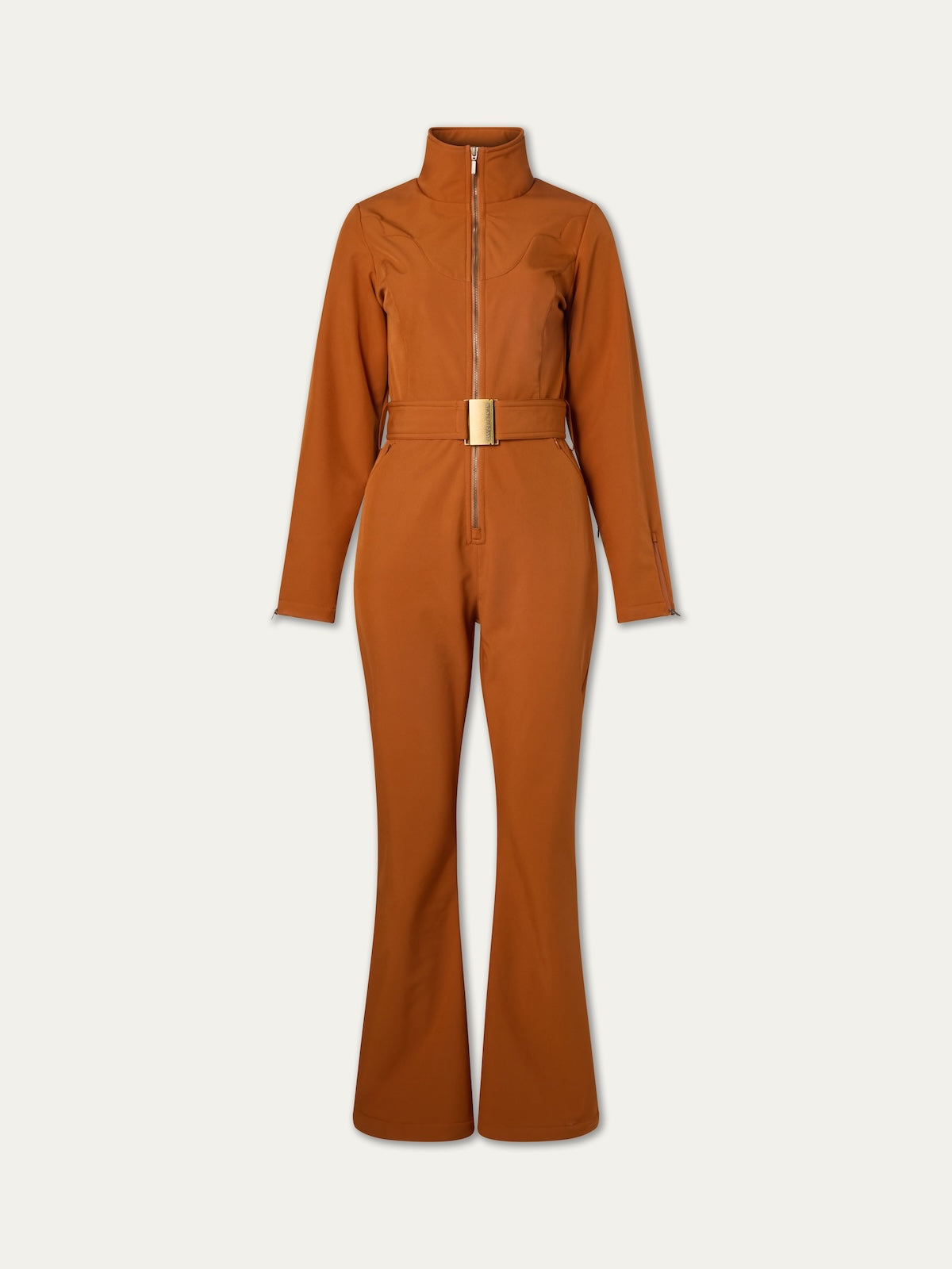 The We Norwegians Western Ski Suit women features a rust color, long sleeves, zip-up front, high collar, wide legs, and a matching belted waist, capturing après-ski style against a plain light background.