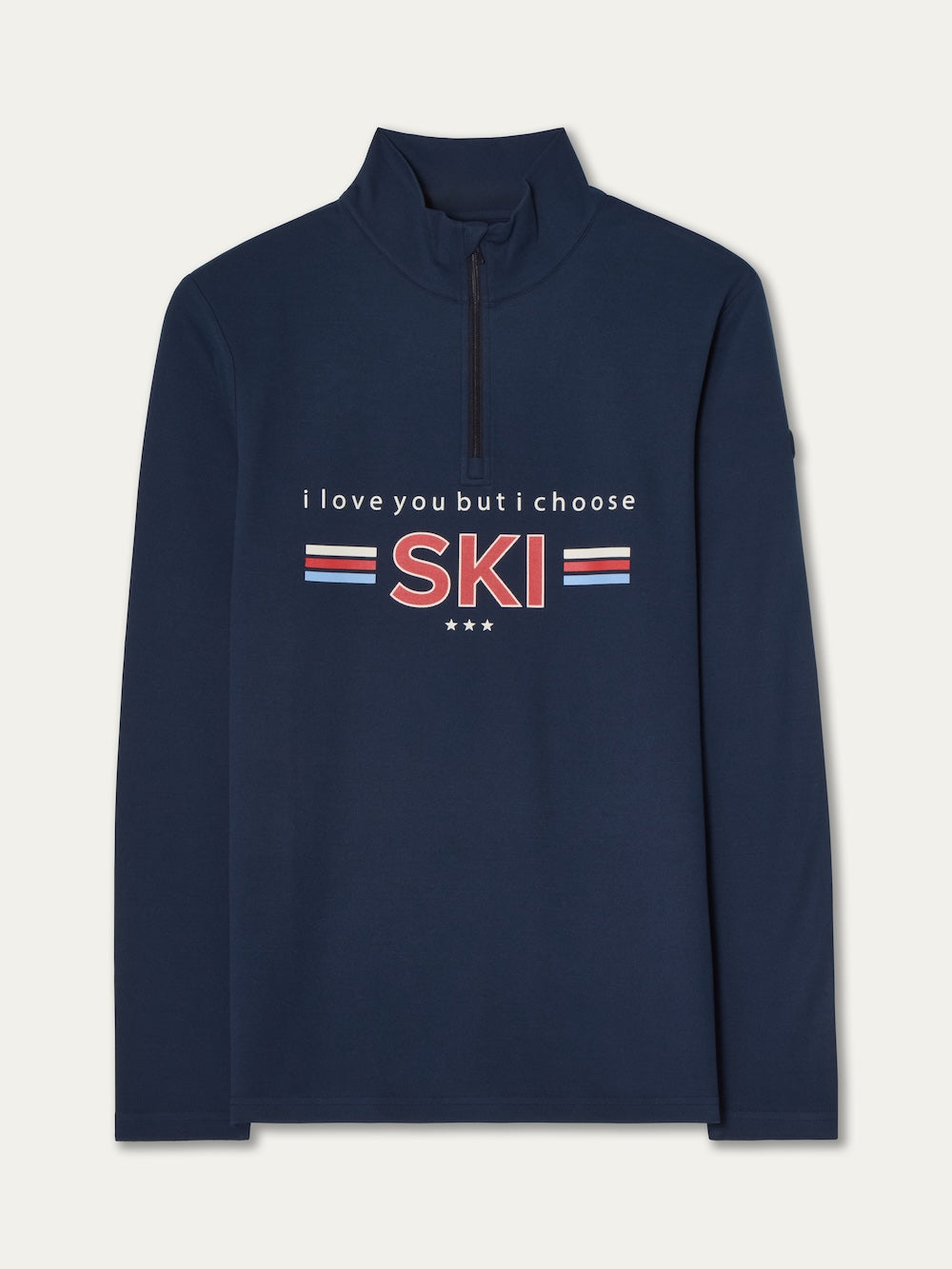 The Moore ZipUp men by We Norwegians is a navy blue, long-sleeve retro ski base layer with a half-zip, "i love you but i choose SKI" in bold red and white text, accented by red, white & blue stripes and three stars underneath.