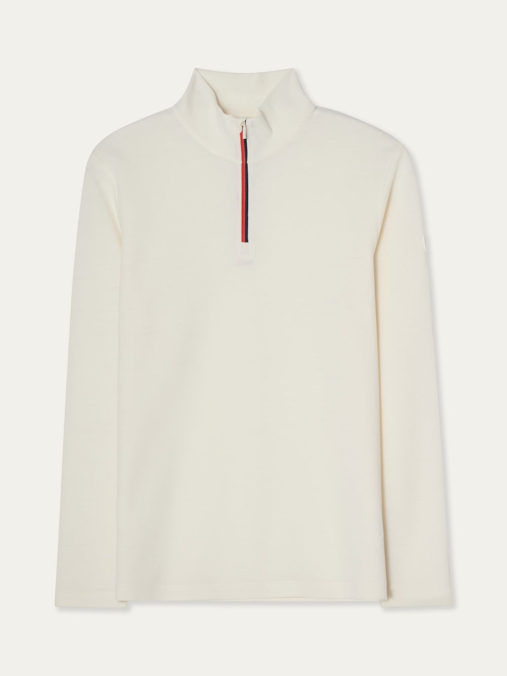 The Moore ZipUp Solid men by We Norwegians is a cream-colored base layer with a high collar, long sleeves, half-zip front, and alpine-inspired red and navy stripe detailing along the zipper.