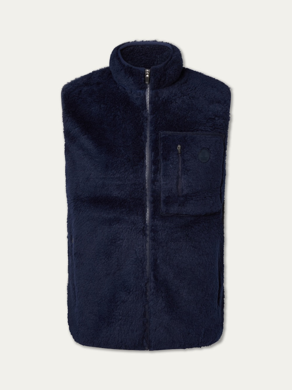 The We Norwegians Kebnekaise Vest men, in navy blue wool-blend pile, features a front zipper and a zippered left chest pocket, making it an ideal après ski mid-layer, shown against a plain light background.