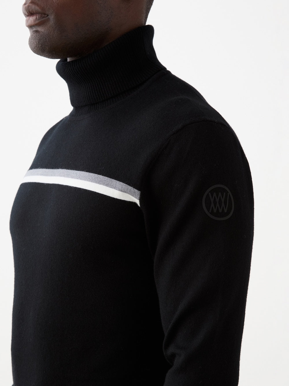 Black turtleneck sweater with white and gray stripes on a white background