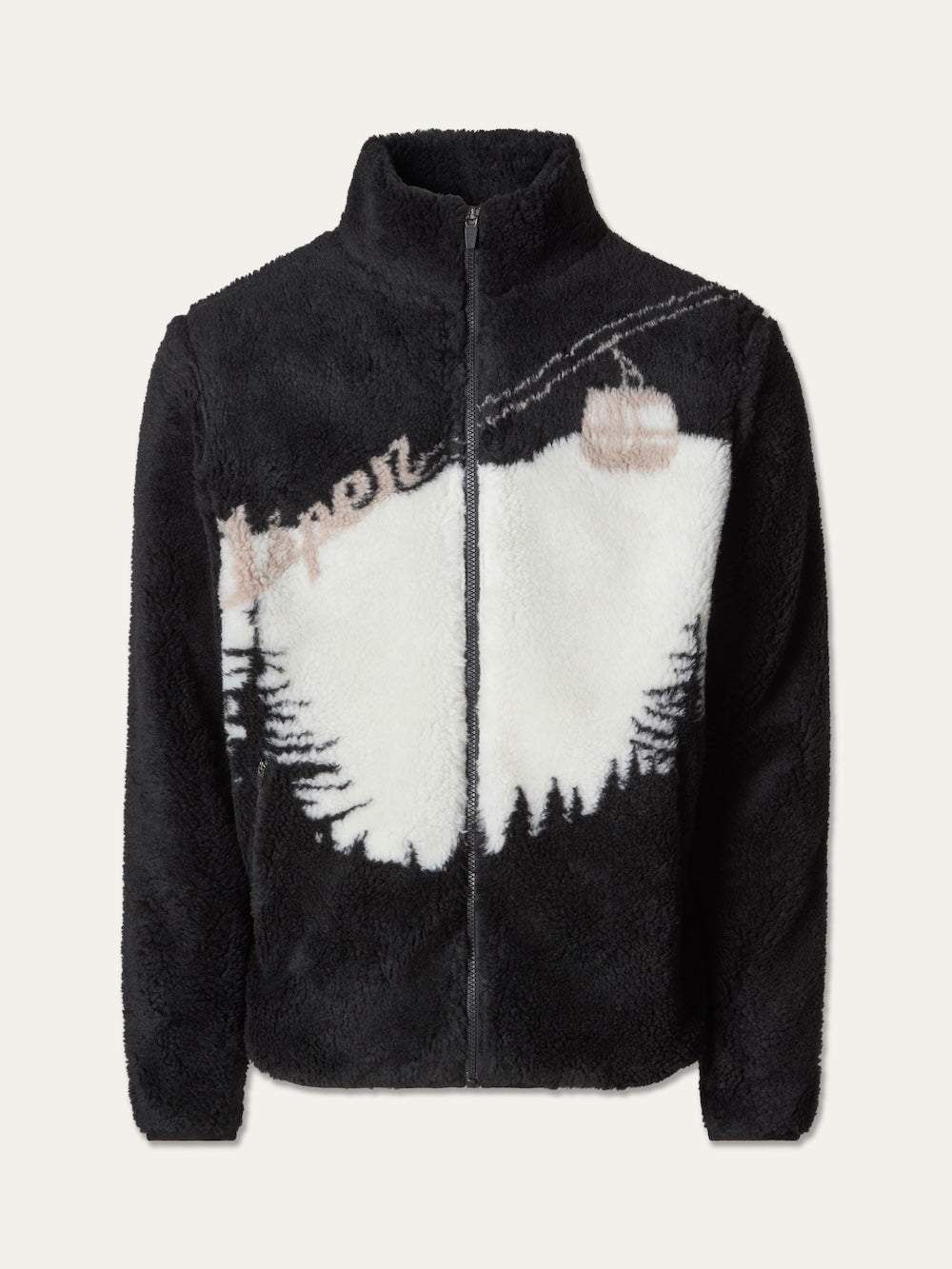 The We Norwegians Snowmass Jacket men is a black and white fleece jacket featuring a mountain landscape with trees and a cable car, along with “Aspen” written in script across the upper chest—perfect for après ski wear.