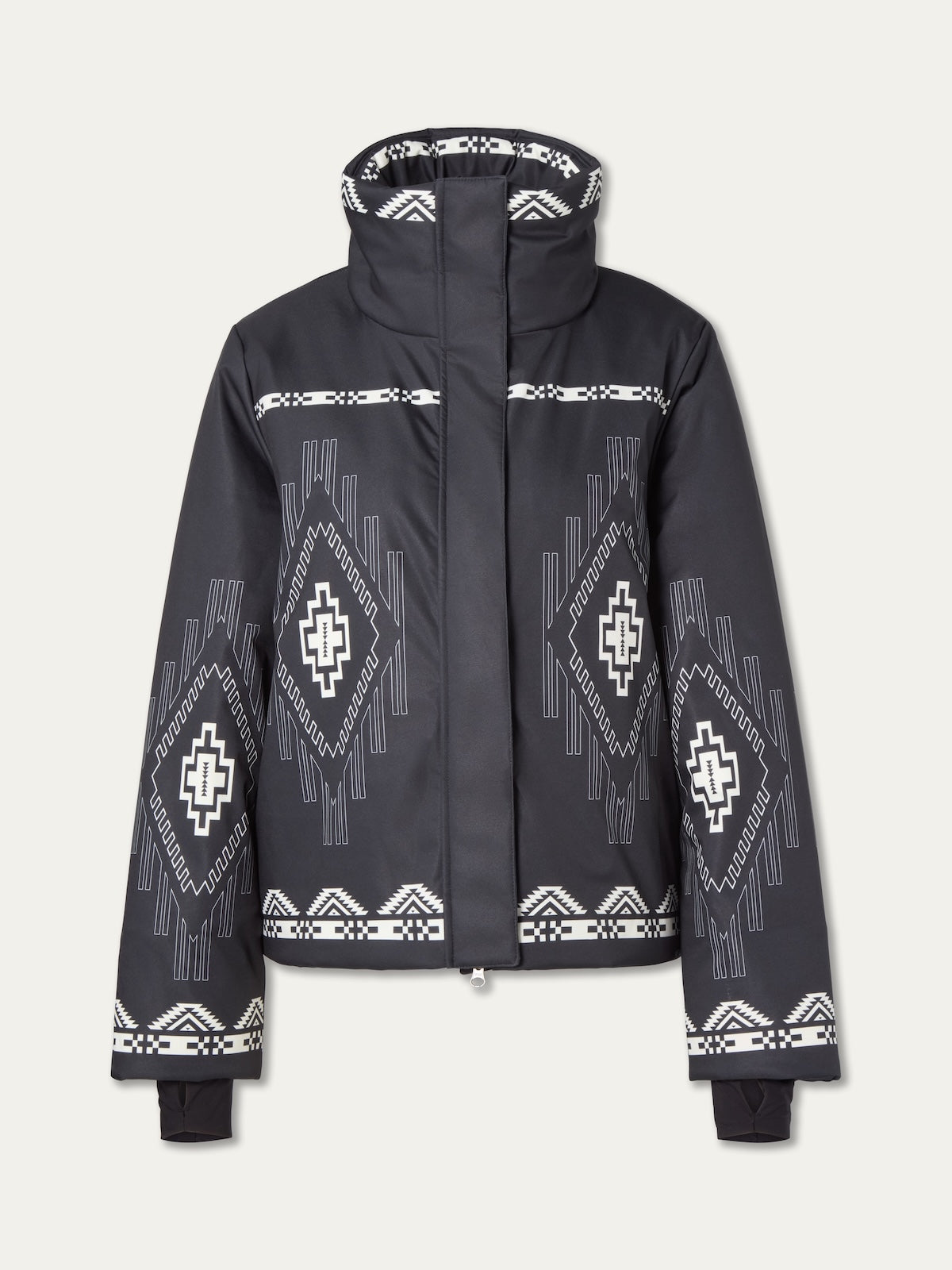 The We Norwegians Pioneer Ski Jacket for women features black fabric with white diamond and cross geometric patterns on the sleeves, chest, and high collar, inspired by Native American design, and includes a stylish front zipper for function.