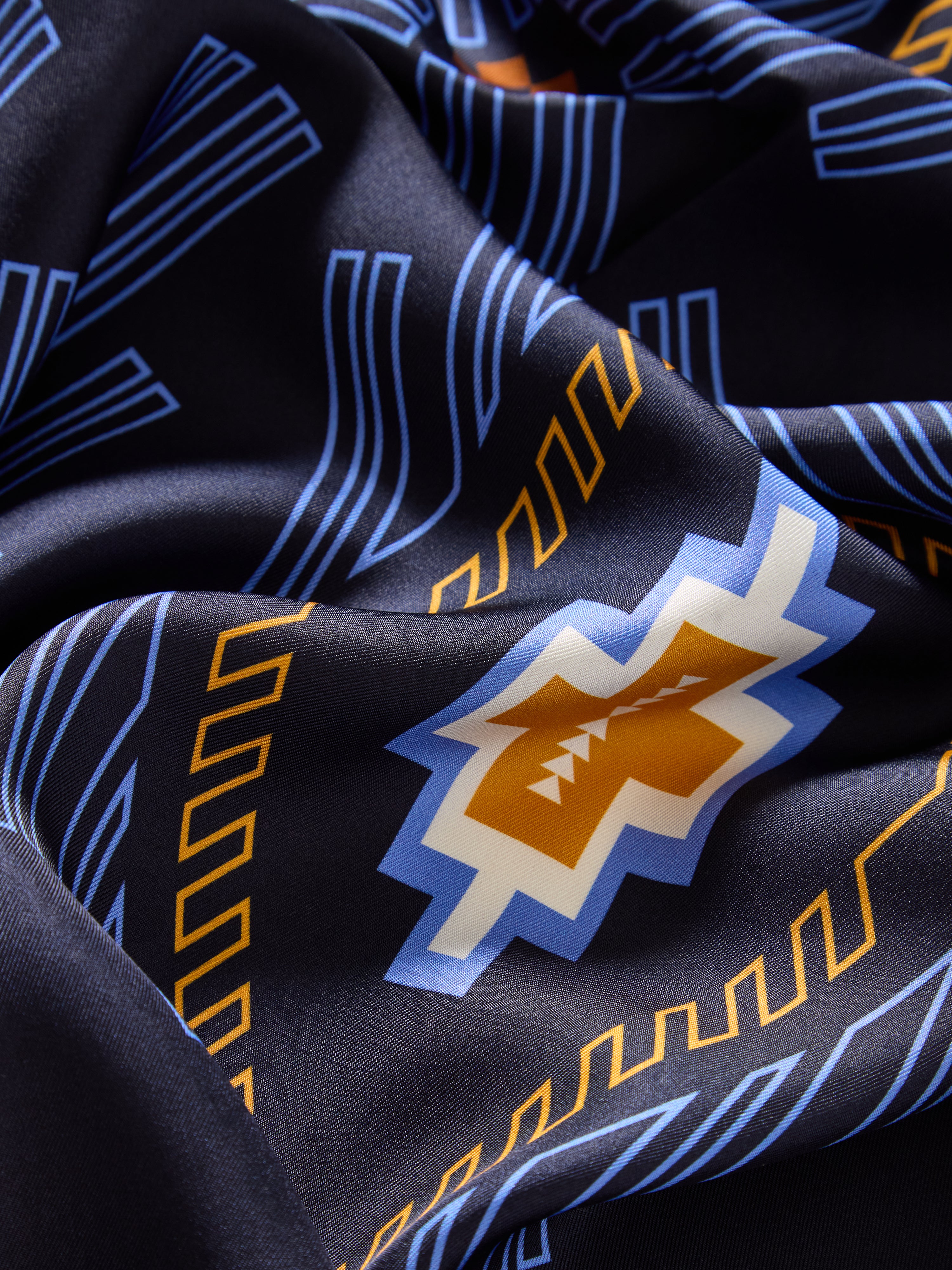 We Norwegians | FW25 | Pioneer Silk scarf_Navy Blue | A pure silk scarf printed with motifs inspired by Indigenous Native American | Picture showing the fabric and print details