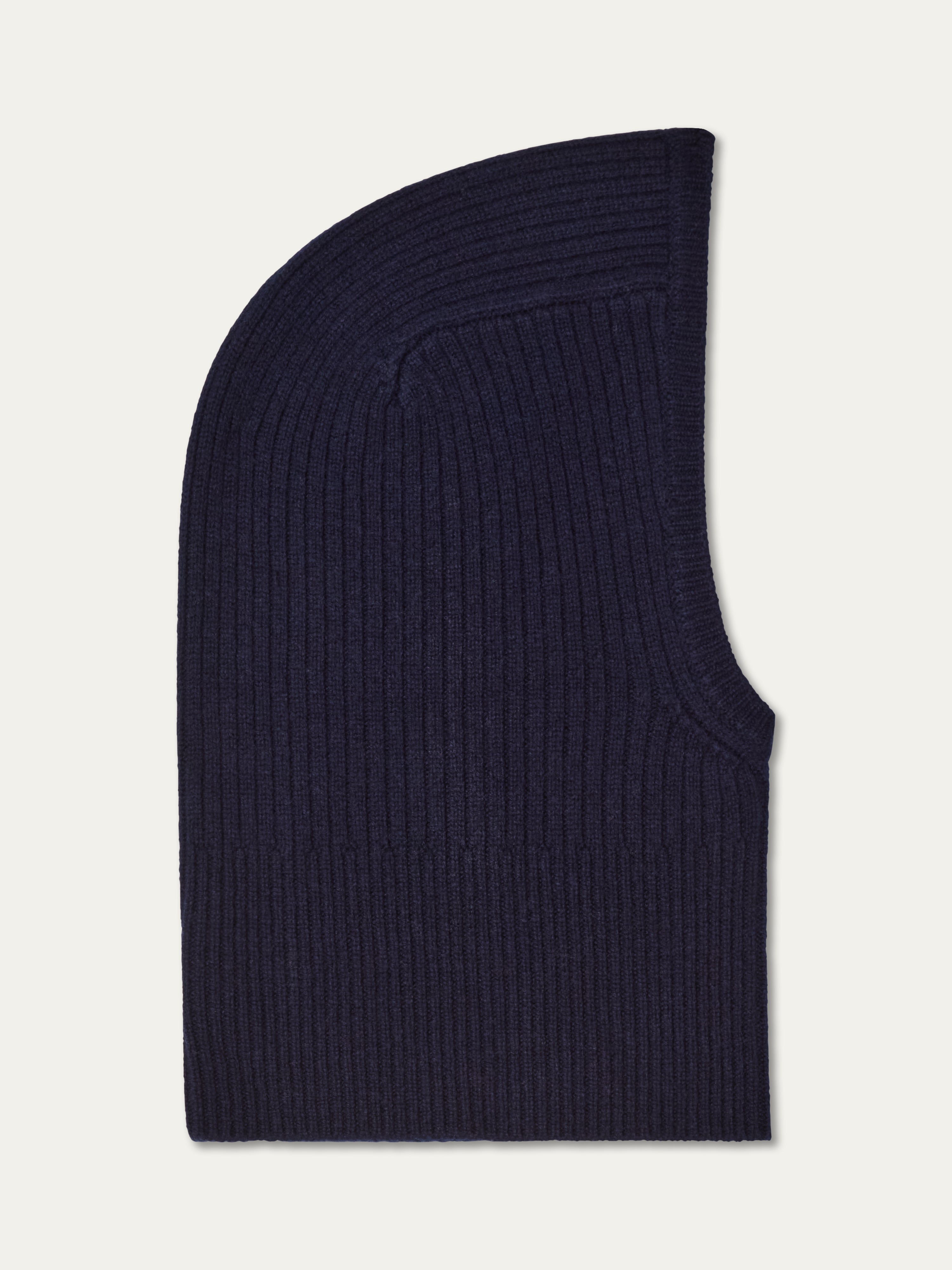The Dal Balaclava by We Norwegians is a dark navy ribbed Merino wool balaclava with a rounded top and right-side face opening, shown flat on a light background—ideal for Scandinavian winters.