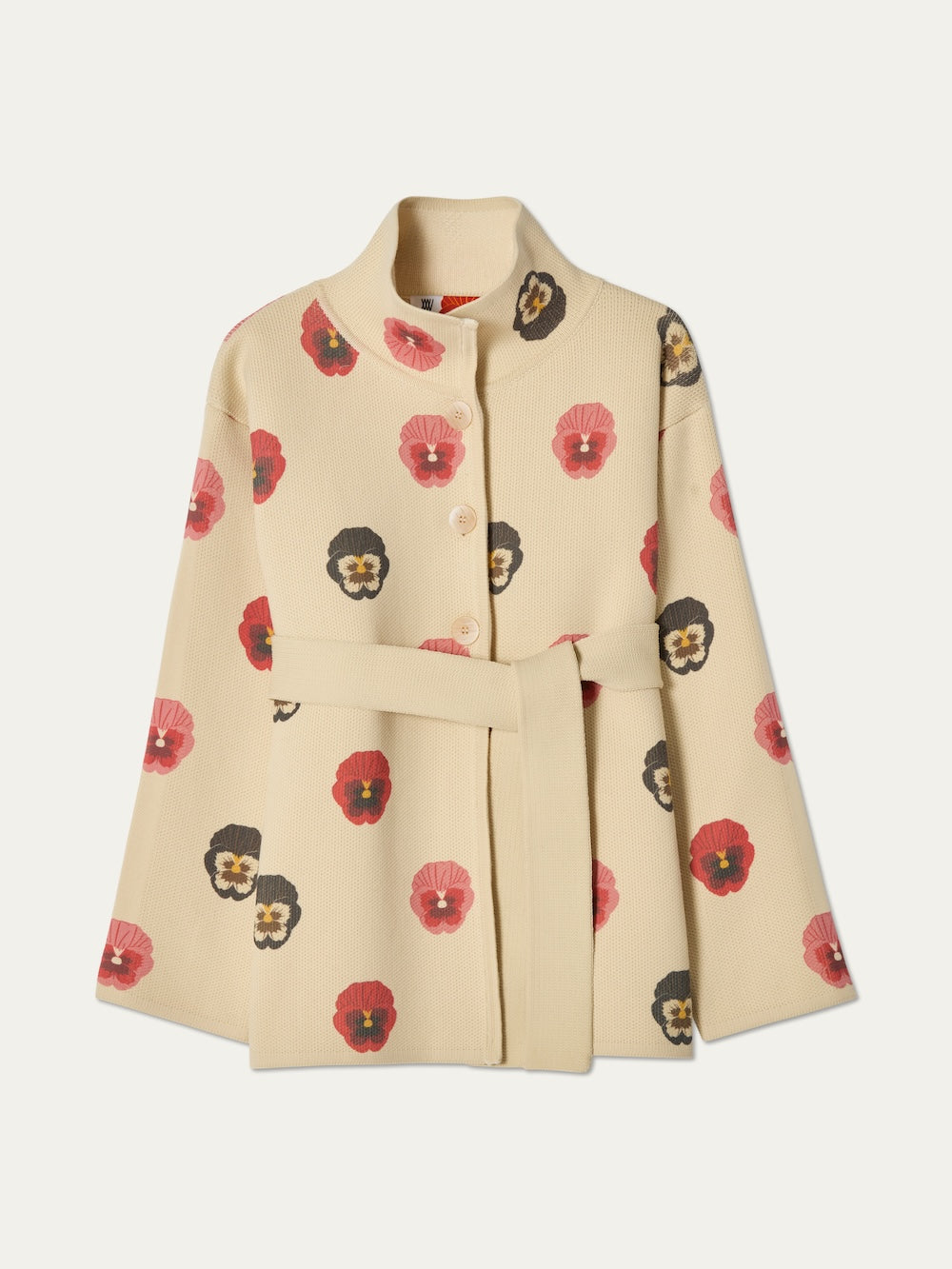 The WN x Markarian Jacket women by We Norwegians features a cream hue, long sleeves, and a belt. Made from digitally printed wool with red and dark brown pansy flowers, this limited edition jacket is shown on a plain background.