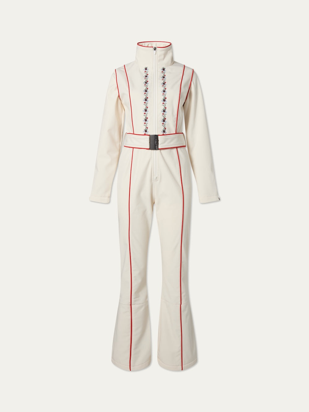 The WN x Markarian Ski Jumpsuit by We Norwegians is a cream long-sleeve, vintage-inspired suit with red piping, high collar, belted waist, flared legs, and floral embroidery—part of the limited edition collaborative collection.