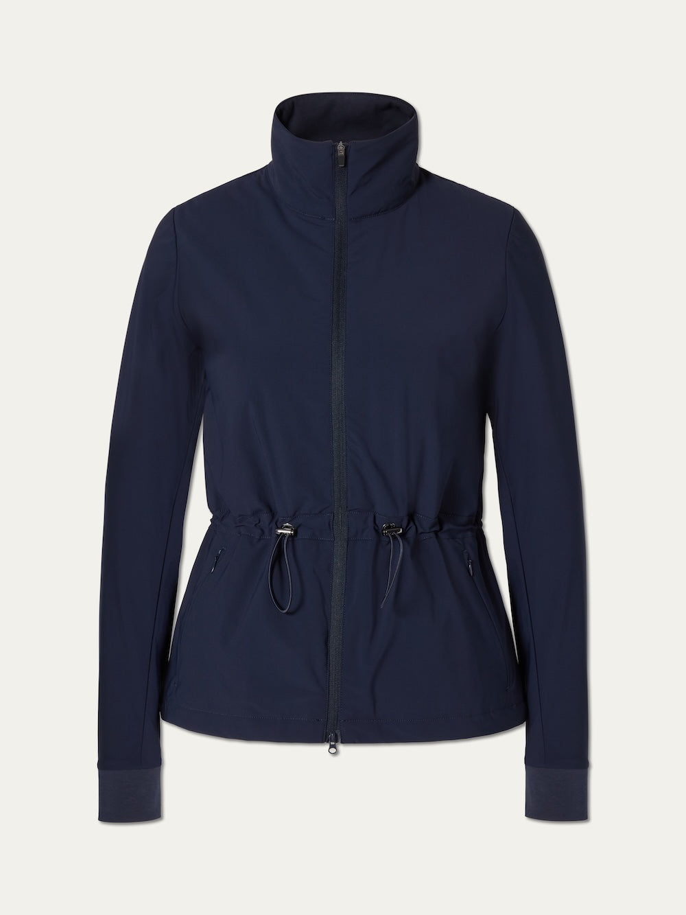 The Albatross Jacket Women by We Norwegians is a navy zip-up golf jacket with a high collar, adjustable drawstring waist, front pockets, and wide-cuff long sleeves. Made from stretch fabric, it has a minimalist design and is shown on a plain background.