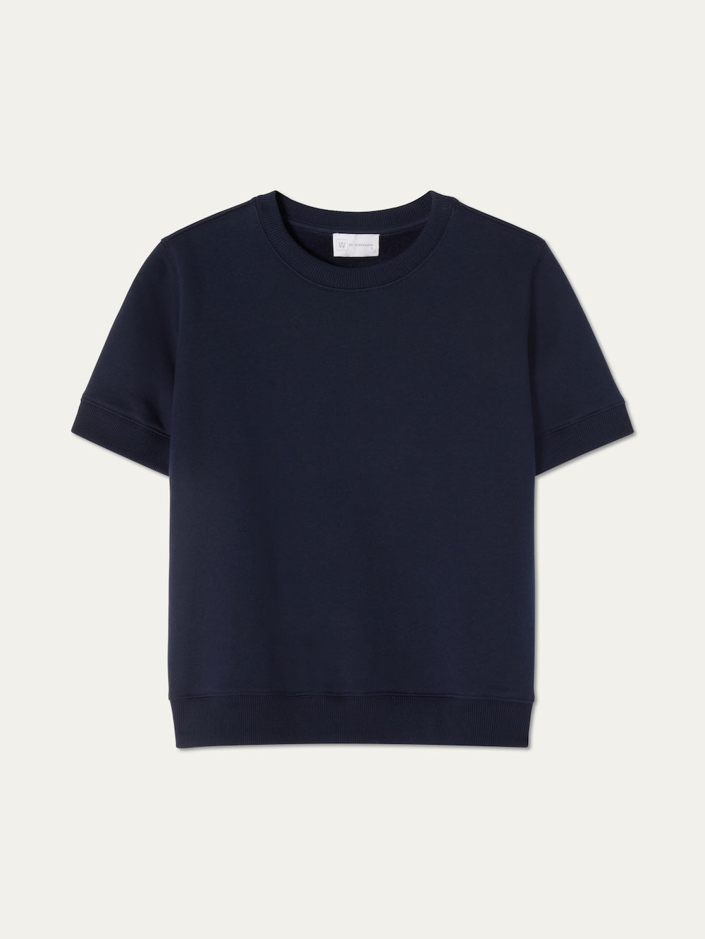 The We Norwegians Bounce Top Women is a navy blue, sporty short-sleeve cotton sweatshirt with a crew neckline, shown against a light, neutral background.