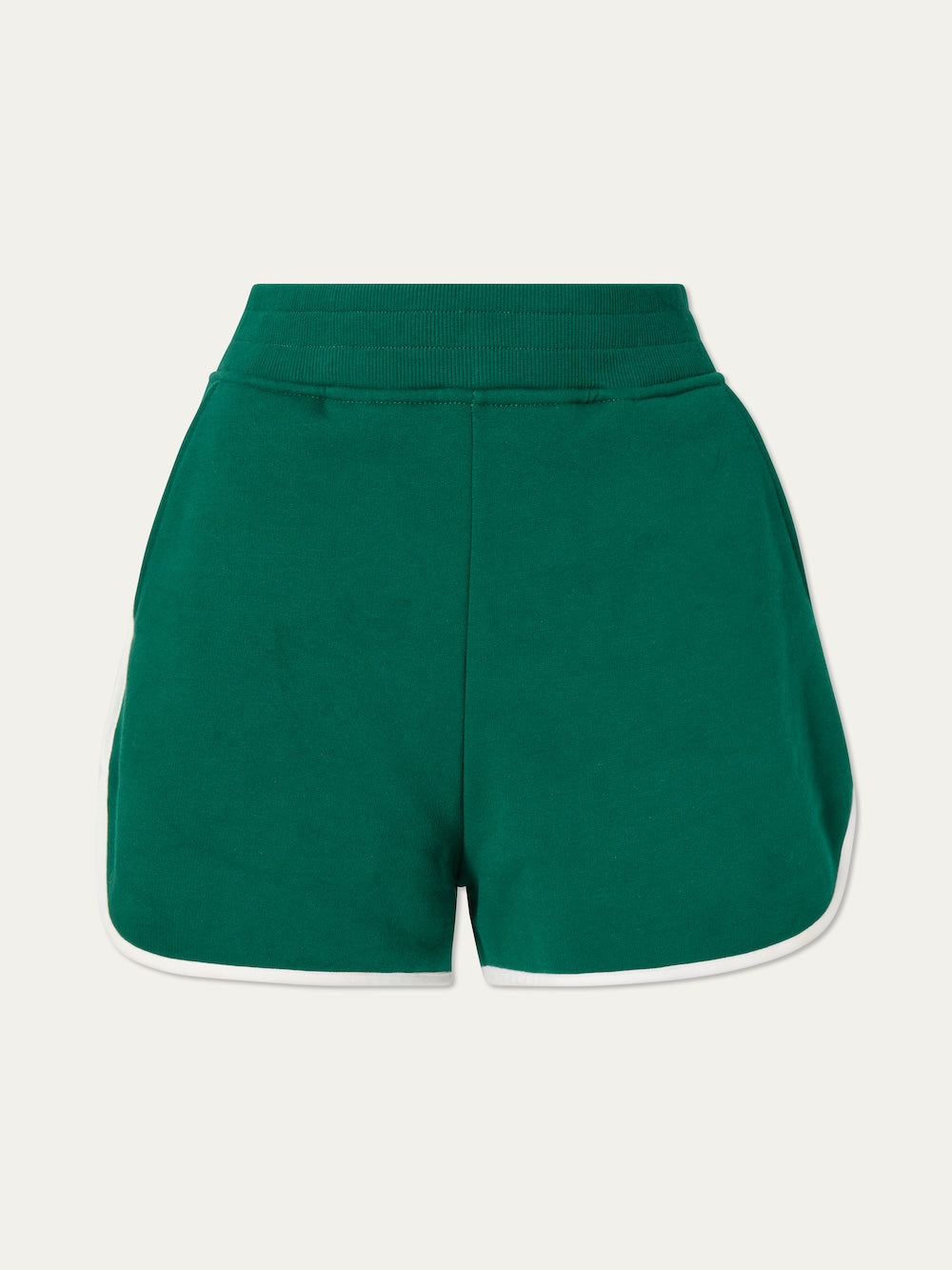 The We Norwegians Bounce Shorts Women feature soft cotton sweatshirt fabric, a high elastic waistband, flared legs, side pockets, and white trim for a classic 70s tennis vibe—shown against a plain light background.