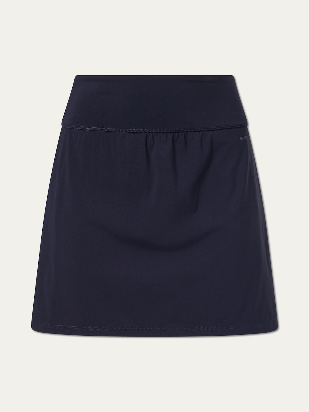 The We Norwegians Honor Skirt Women is a dark navy tennis skirt featuring a wide waistband, built-in shorts, and a sleek design, shown against a plain white background.
