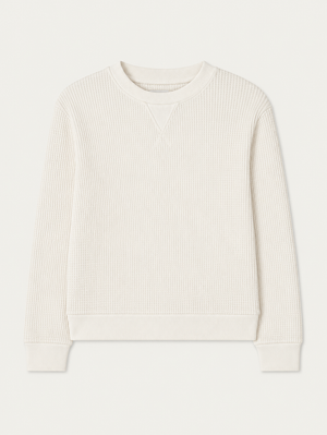 The We Norwegians Waffle Crewneck Women is a cream long-sleeve sweatshirt with ribbed cuffs, collar, and hem in a relaxed fit, shown laid flat on a white background.