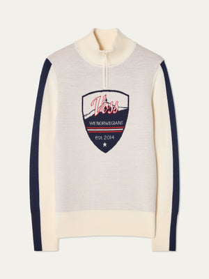 We Norwegians | FW25 | Womens Afterski ZipUp_Cream | A mid-weight knit quality sweater with a front 1/4th zipper opening with a unique design and logo on the chest and contrasting panels on the sleeves | Shot against an off-white background