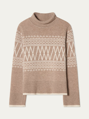 The Setesdal Pullover women by We Norwegians is a beige knit turtleneck sweater with white geometric and diamond patterns across the chest and sleeves, finished with ribbed cuffs and hem.