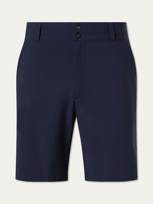The We Norwegians Albatross Shorts Men are navy blue golf shorts with a double-button closure, belt loops, breathable stretch fabric, and side pockets, shown against a plain light background.